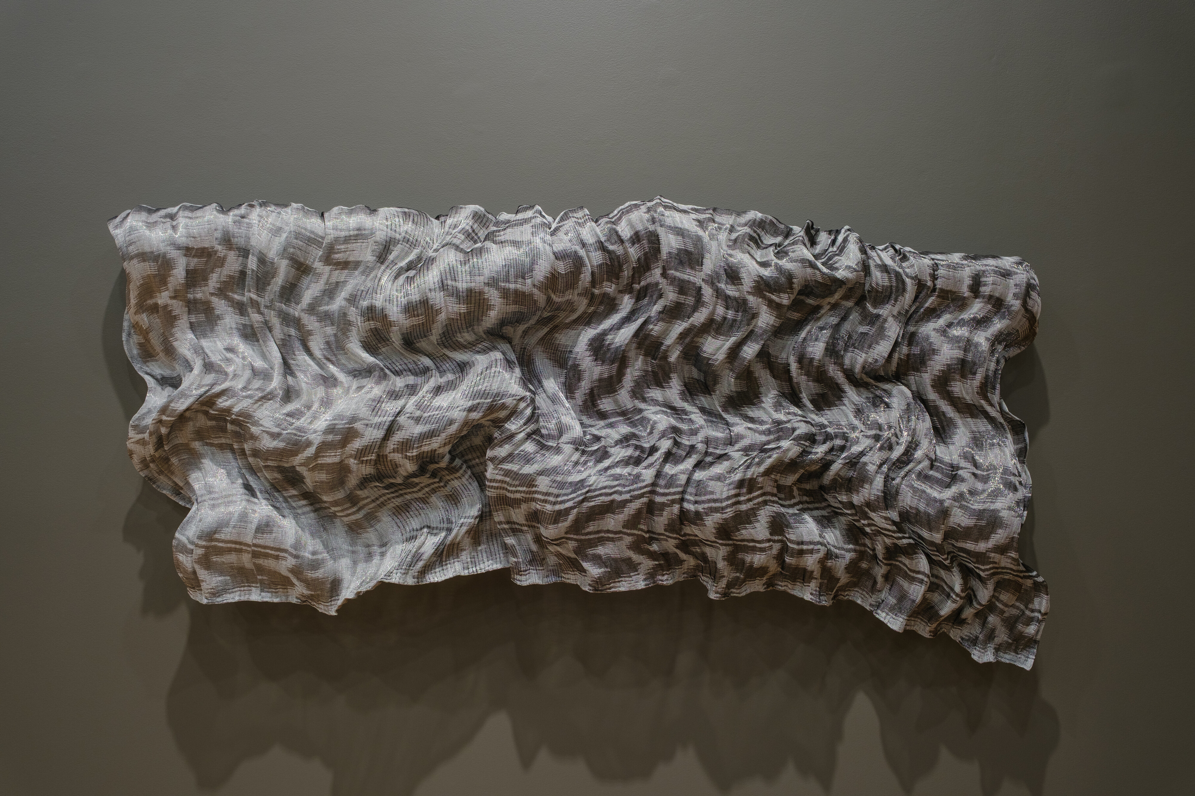 <p>Installation view of Jennifer Robertson, <em>Curved Fold</em>, 2026, stainless steel, quartz, carbon blend fibre, linen, Tamworth Regional Gallery. Photo: Courtesy Tamworth Regional Gallery.</p>
