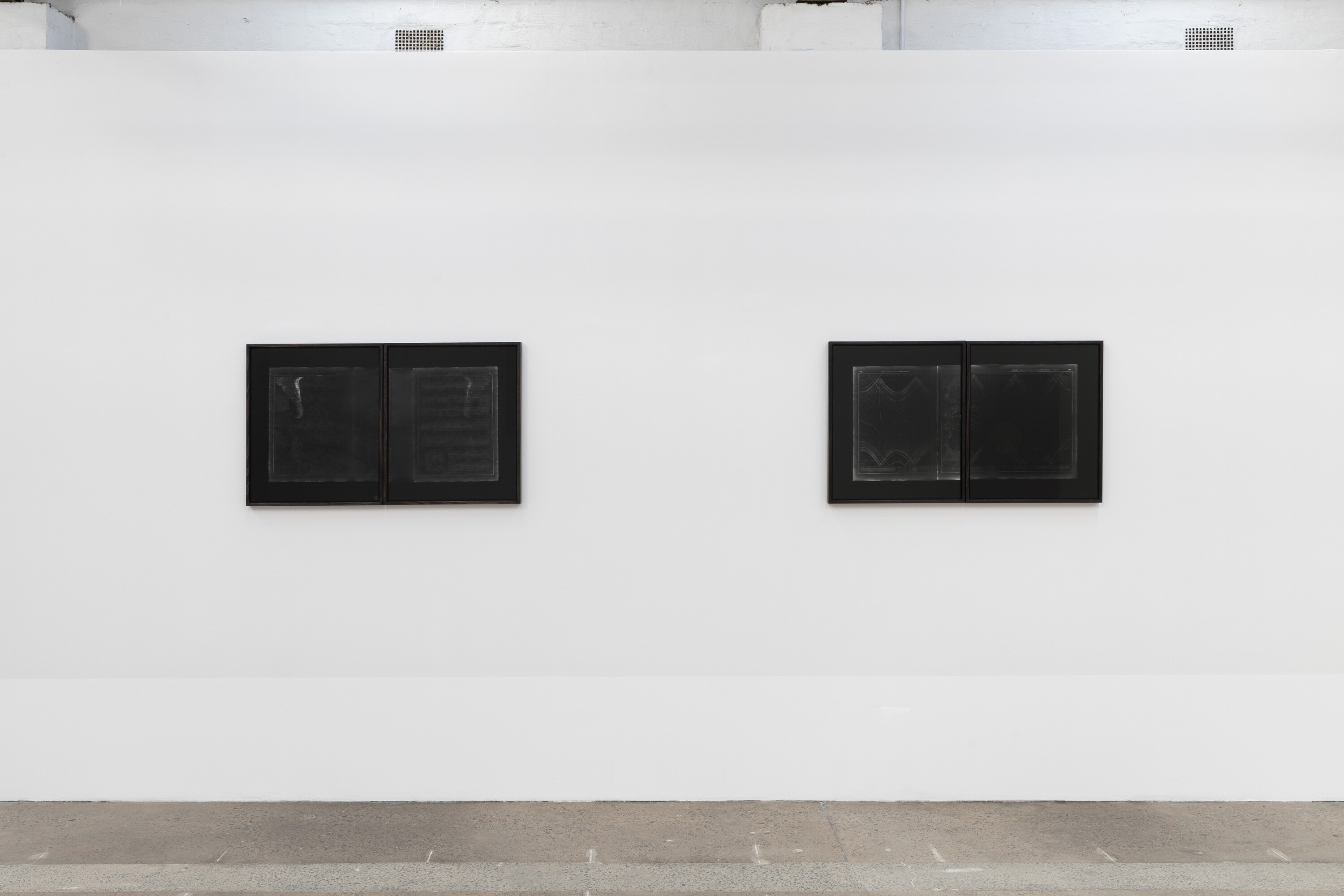 <p>Installation view of Izabela Pluta, <em>Counterspace (The Pacific: visualisation of bottom of the pacific / relief of bottom south parts)</em>, 2021, silver gelatin photographs (contact negatives) (left); and Izabela Pluta, <em>Counterspace (The Pacific: twilight schedule / sunset schedule)</em>, 2021, silver gelatin photographs (contact negatives) (right). Photo: Jessica Maurer.</p>