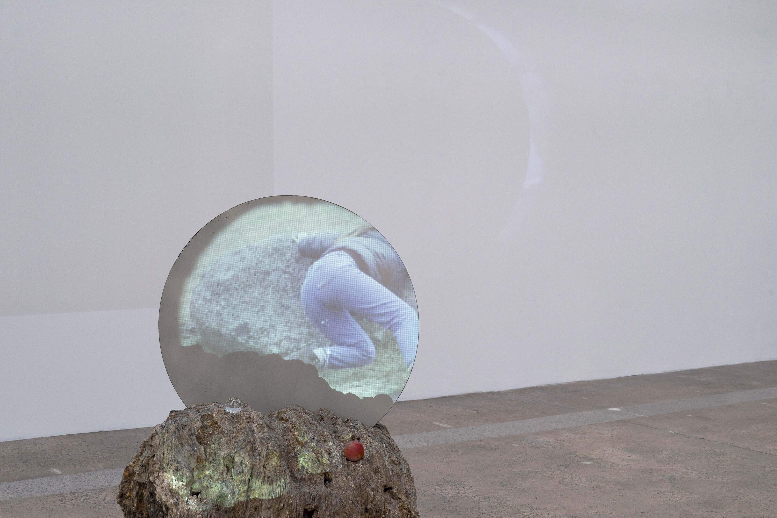 <p>Installation view of Shan Turner-Carroll, <em>Pushing Rocks</em>, 2024. Foam, plaster, acrylic paint, glass, found glasses, found glass, found sticks, video, projector. Dimensions variable. Photo: Jessica Maurer.</p>