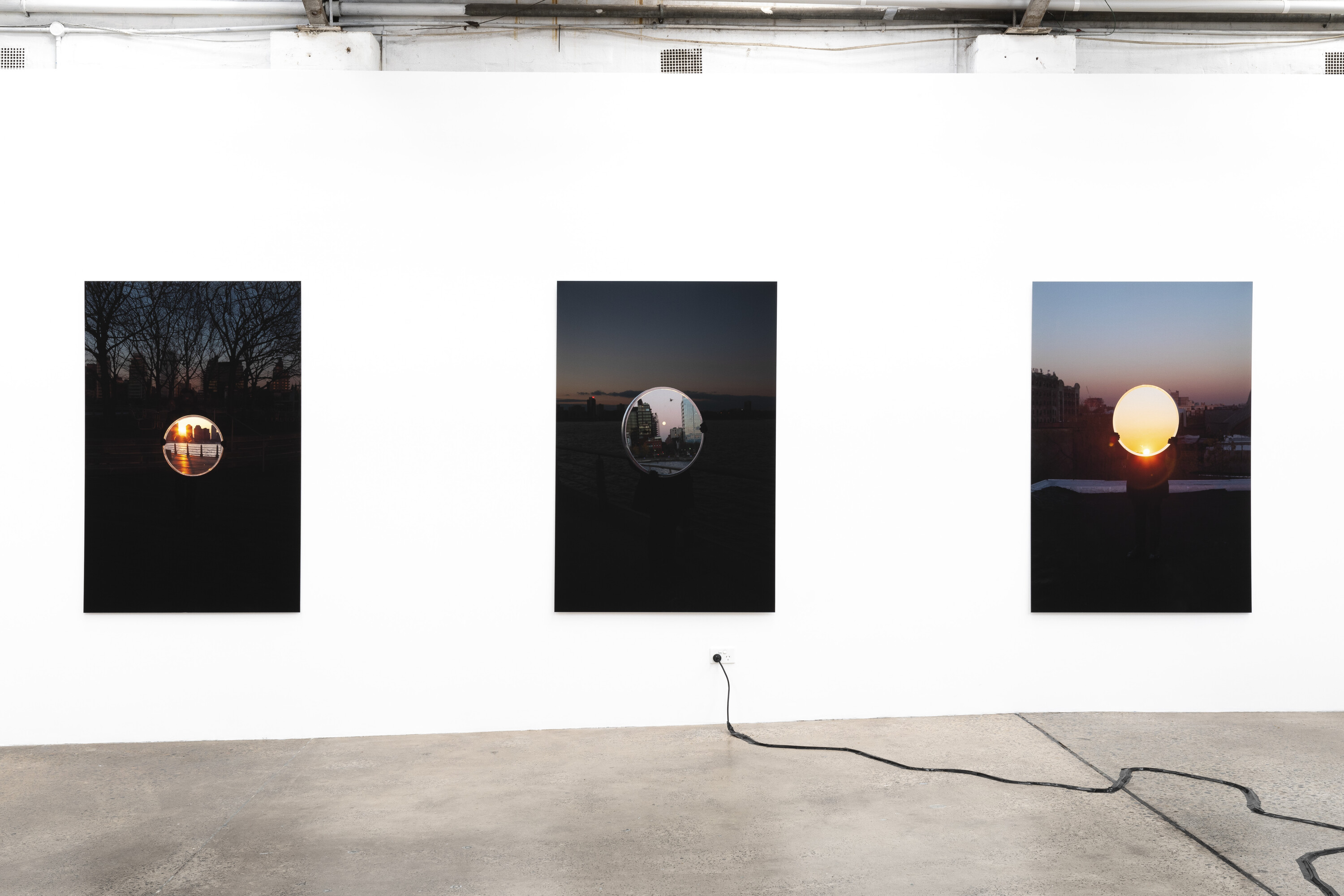 <p>Installation view of Shan Turner-Carroll, <em>Sun and Moon Walk 2</em>, <em>3</em>, and <em>4</em>, 2015. Series of photographic prints mounted on aluminium. Photo: Jessica Maurer.</p>