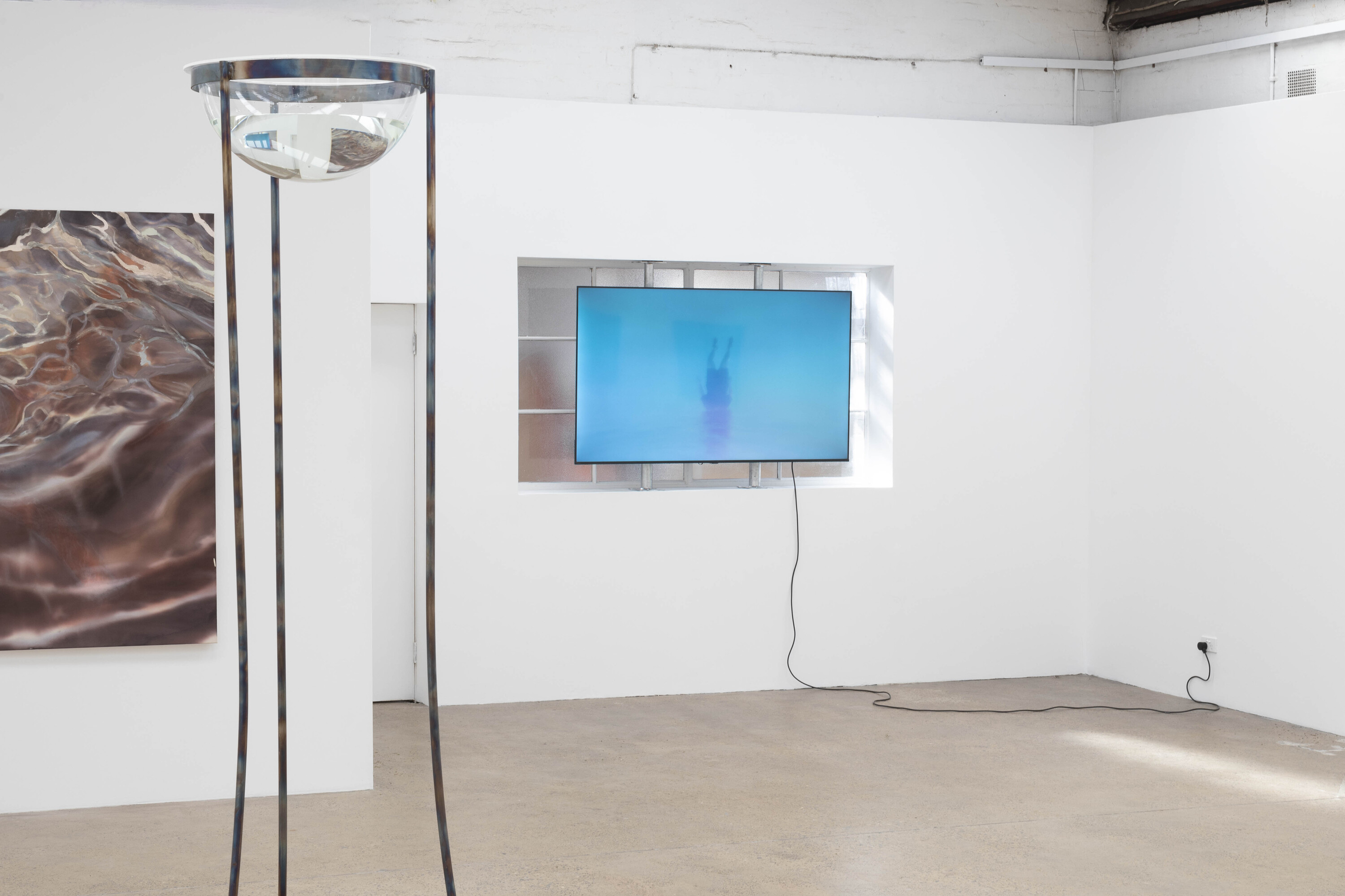 <p>Installation view of <em>A tide is a very long wave</em>. Clara Joyce, <em>Water Vision Instrument</em>, 2023 and <em>Breathing and Chaos</em>, 2024 (left) and Salote Tawale<em>, I don’t see colour</em>, 2021. Video (right). Photo: Jessica Maurer.</p>