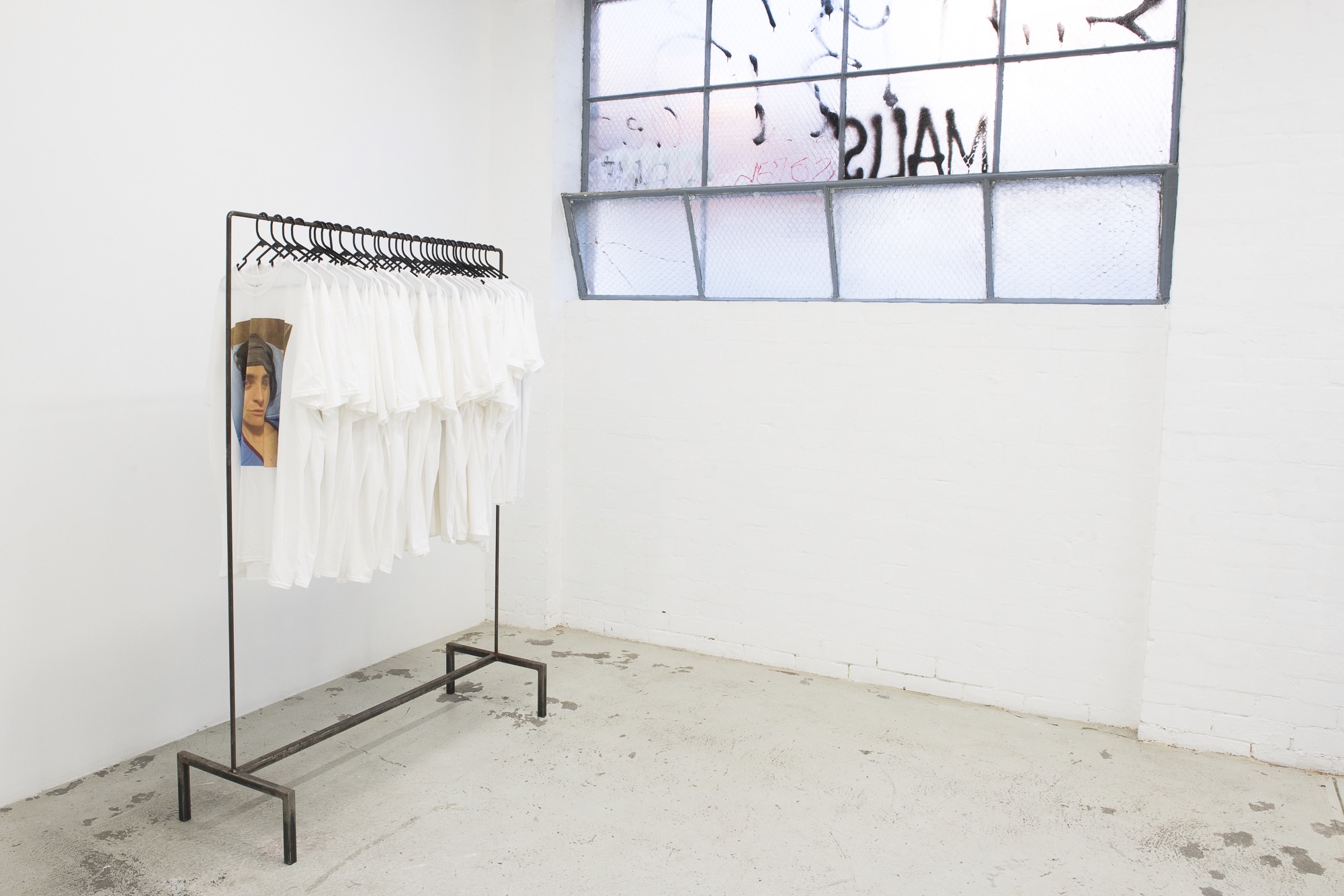 Alex Cuffe, <em>I grieve so much I forget who I am… can you remind me that I exist…? when I cry… I’m trying to be vulnerable… I want you to breath through the feeling in your chest as you wear this..</em>, ​digital print of every time the artist has cried and taken a photo, cotton, stains from her car, borrowed unique clothes rack (with thanks to Isabella Darcy), 2015 – 2020, $50 each. (All profits donated to Indigenous families affected by deaths in custody).
