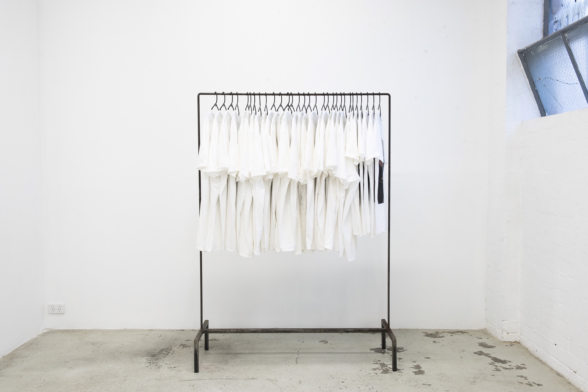 Alex Cuffe, <em>I grieve so much I forget who I am… can you remind me that I exist…? when I cry… I’m trying to be vulnerable… I want you to breath through the feeling in your chest as you wear this..</em>, ​digital print of every time the artist has cried and taken a photo, cotton, stains from her car, borrowed unique clothes rack (with thanks to Isabella Darcy), 2015 – 2020, $50 each. (All profits donated to Indigenous families affected by deaths in custody).