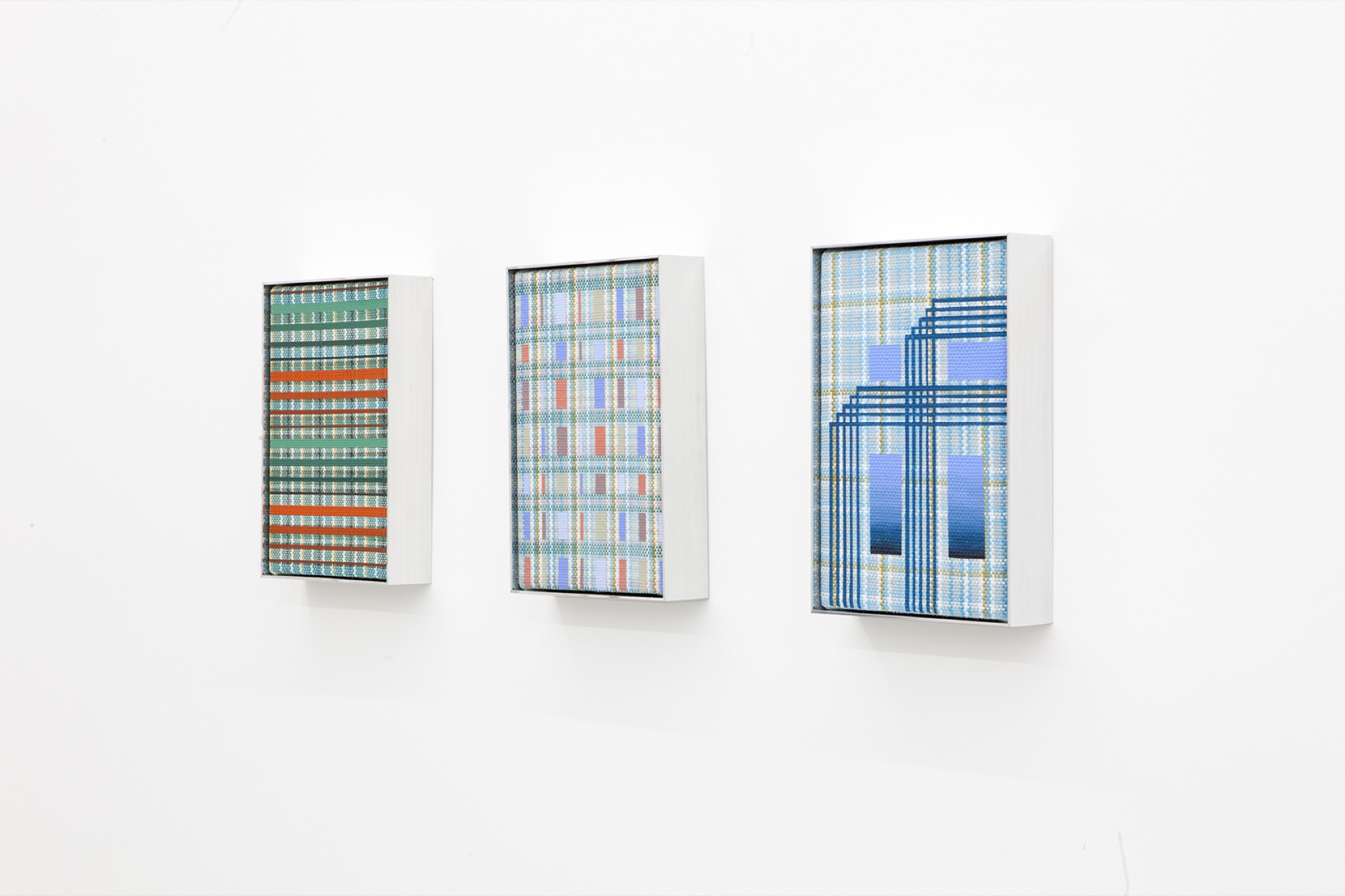 Tia Ansell, <em>Roche</em>, <em>Brooks</em>, <em>Marine</em>, all 2021. Acrylic on cotton and wool handmade weaving in custom aluminium frame, 33 × 22 × 6 cm each. LON Gallery, Melbourne. Image courtesy of LON Gallery.