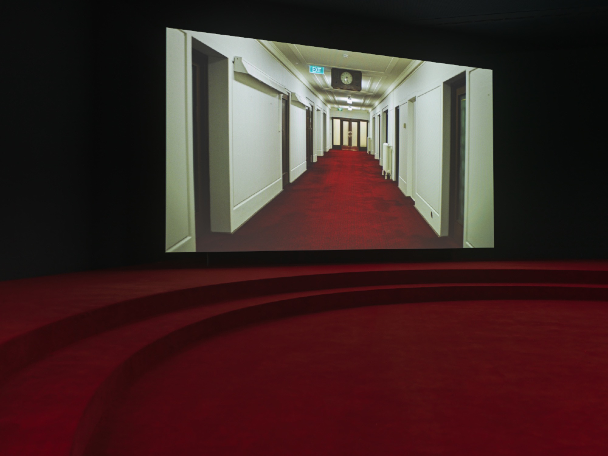 Angelica Mesiti, <em>ASSEMBLY</em>, 2019 (installation shot) three-channel video installation in architectural amphitheater. HD video projections, color, six-channel mono sound, 25 mins, dimensions variable. © Photography: Josh Raymond. Commissioned by the Australia Council for the Arts on the occasion of the 58th International Art Exhibition–La Biennale di Venezia. Courtesy of the artist and Anna Schwartz Gallery, Australia and Galerie Allen, Paris.