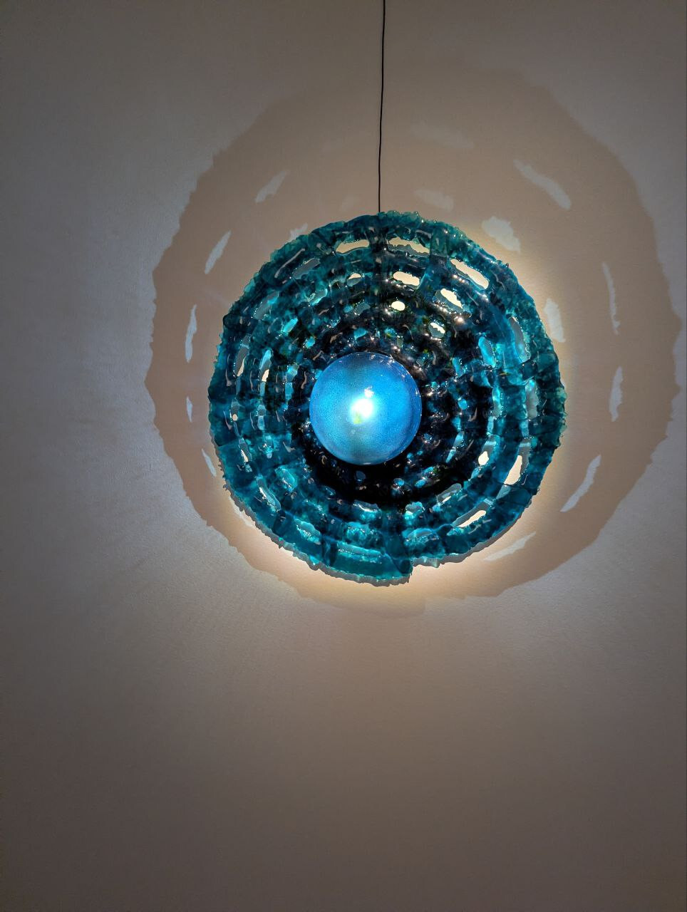 <p>Tamara Henderson, <em>Web Wall Light Blue</em>, 2025. Fused Bullseye glass. 60 x 60 x 2 cm</p>