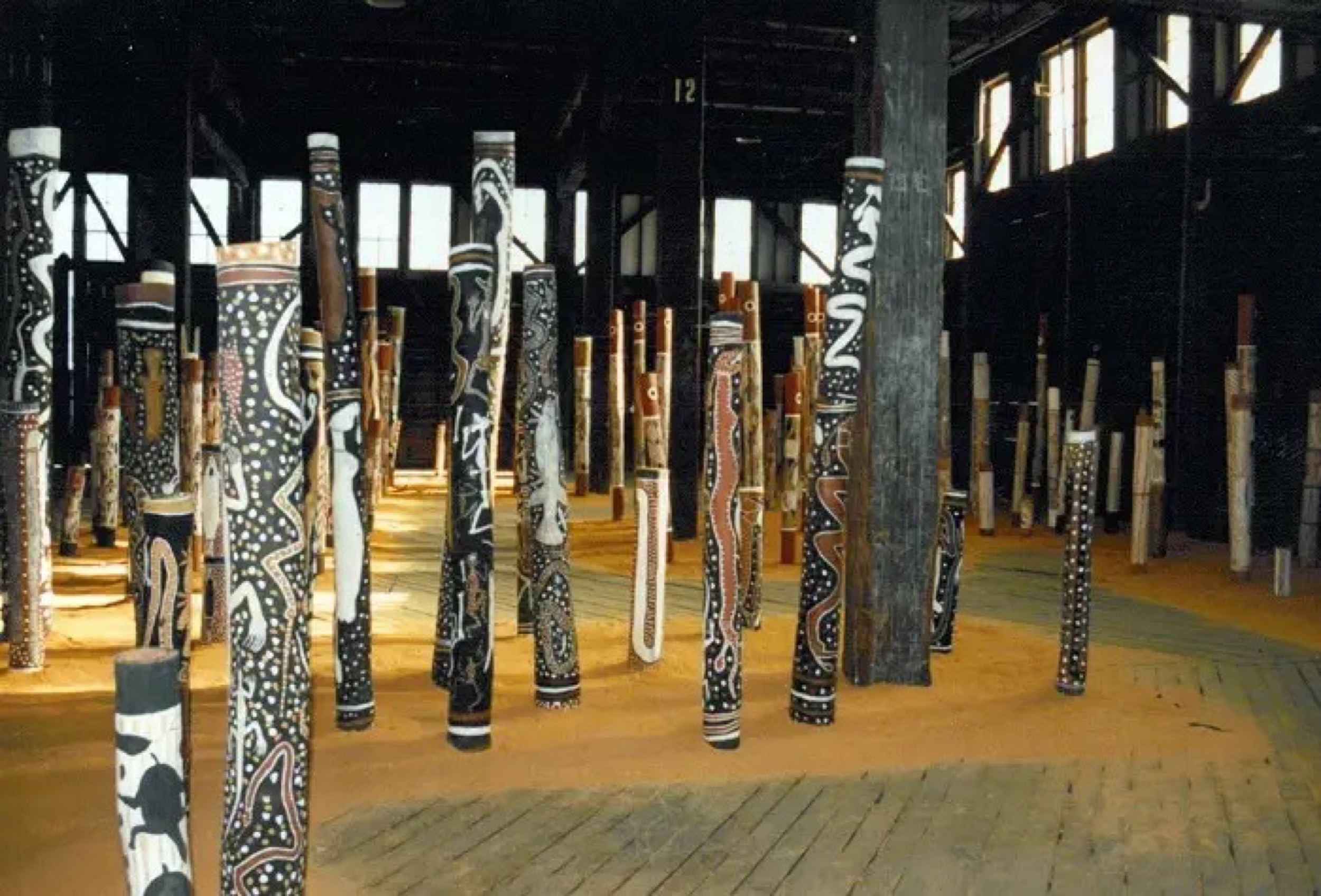 <p><em>The Aboriginal </em>Memorial, 1987–88, 200 hollow log bone coffins, installation view, <em>7th Biennale of Sydney</em>, Pier 2/3, 1988. Courtesy of the artists and the Biennale of Sydney</p>