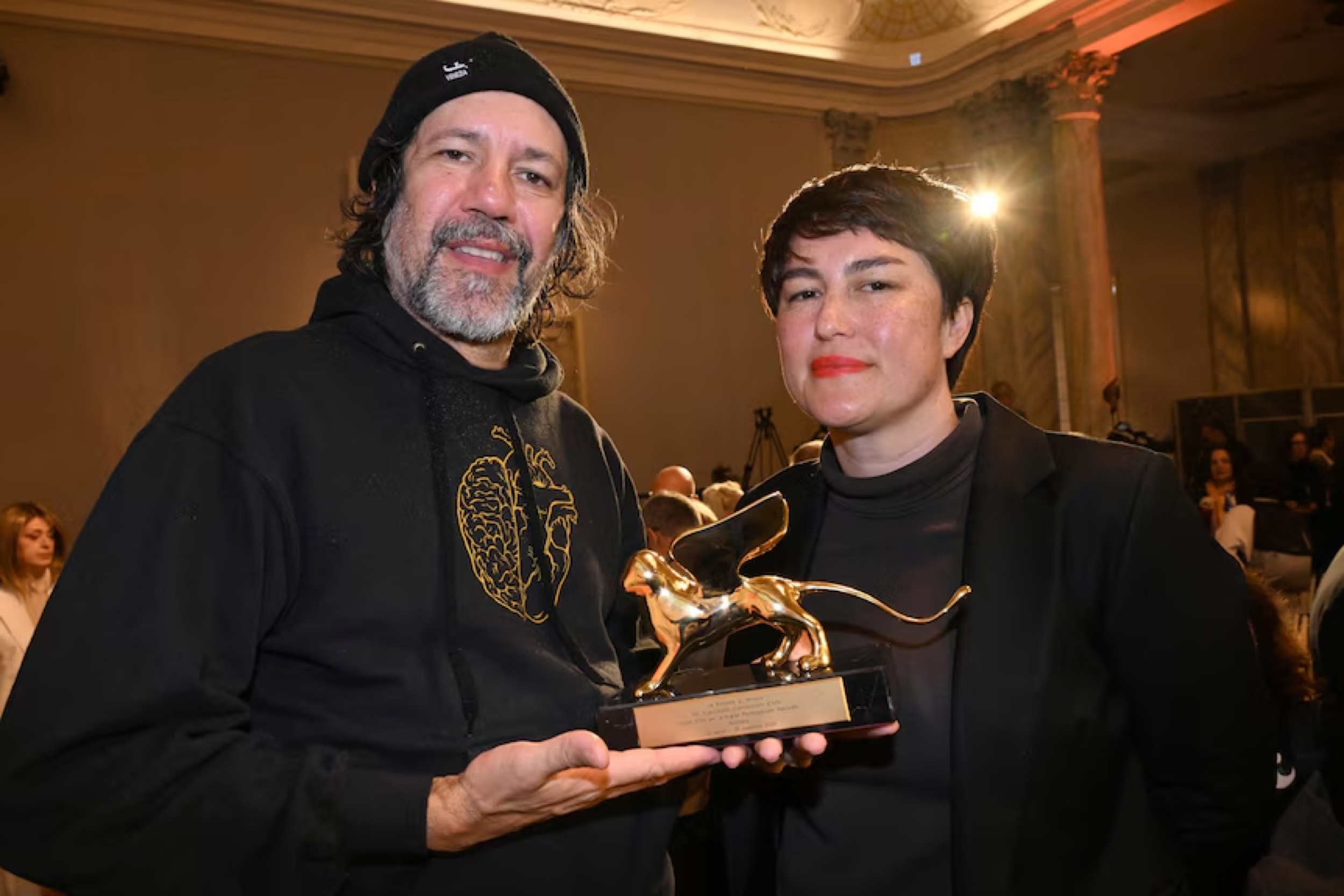 <p>Moore and Buttrose with the Golden Lion at the Biennale’s award ceremony. Getty Images: Felix Horhage</p>