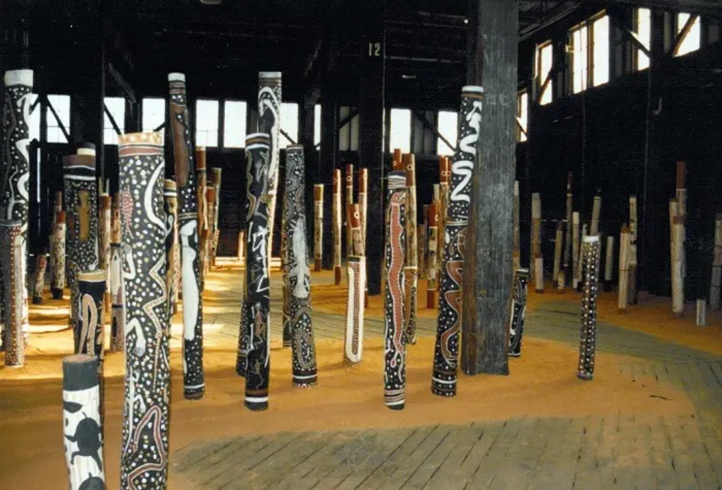 <p><em>The Aboriginal </em>Memorial, 1987–88, 200 hollow log bone coffins, installation view, <em>7th Biennale of Sydney</em>, Pier 2/3, 1988. Courtesy of the artists and the Biennale of Sydney</p>