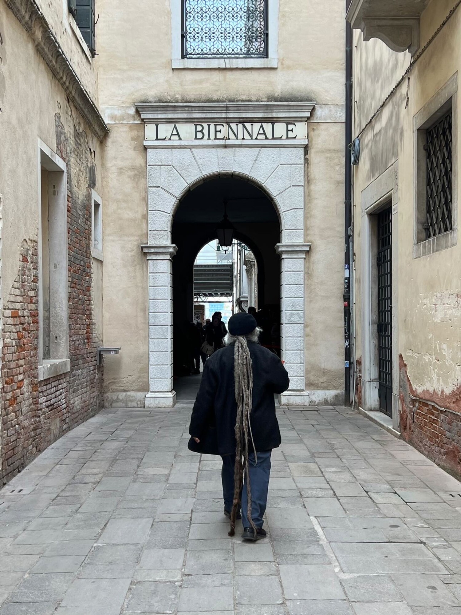 <p>Djon Mundine and his crown of dreadlocks entering the Venice Biennale. Photo: The Commercial</p>