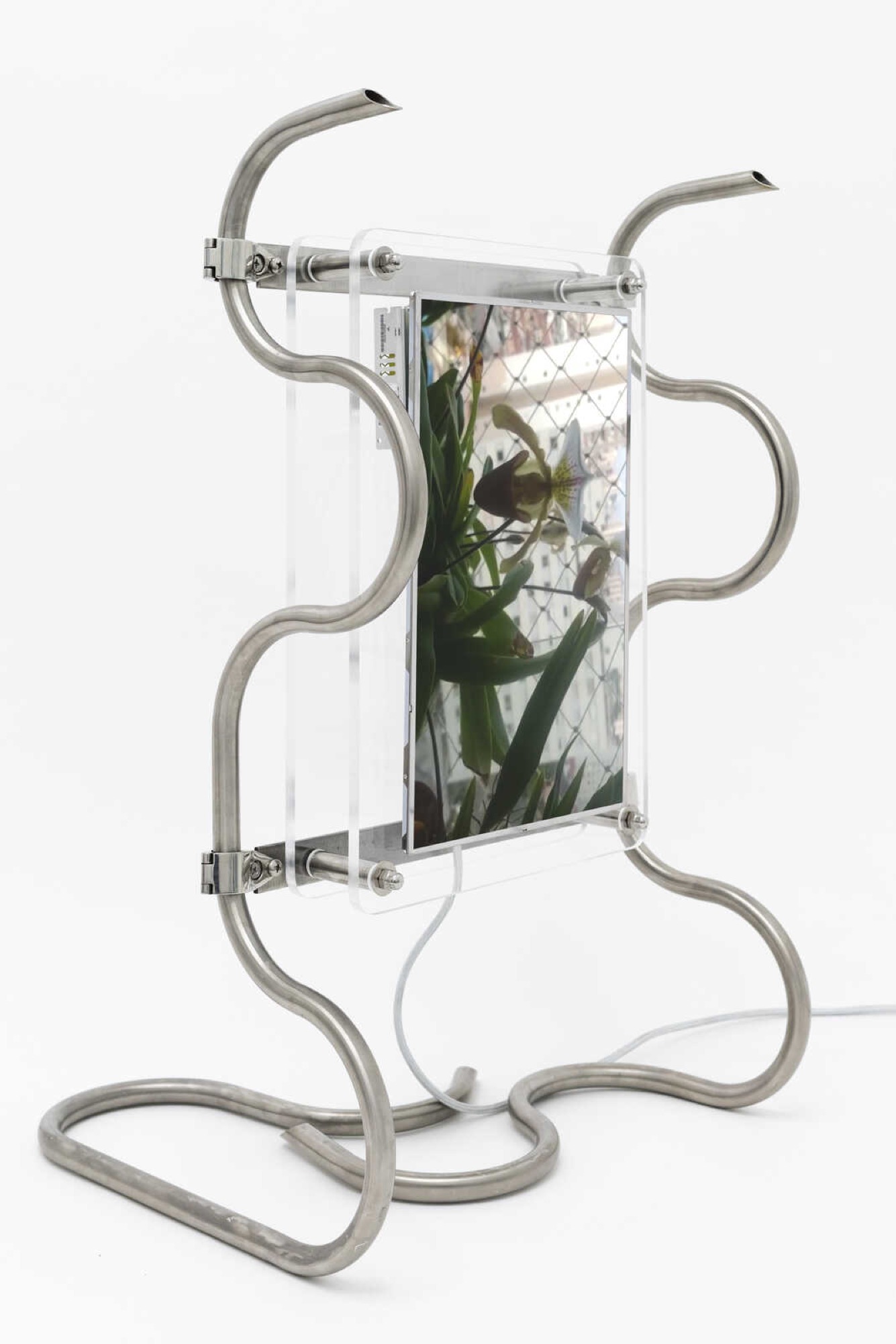 Amalia Lindo, <em>The Cloud is of the Earth (v.1)</em>, 2021. Single channel video installation, audio, 17” liquid-crystal display panel, LCD controller board, stainless steel tube, acrylic perspex. Courtesy Haydens Gallery.