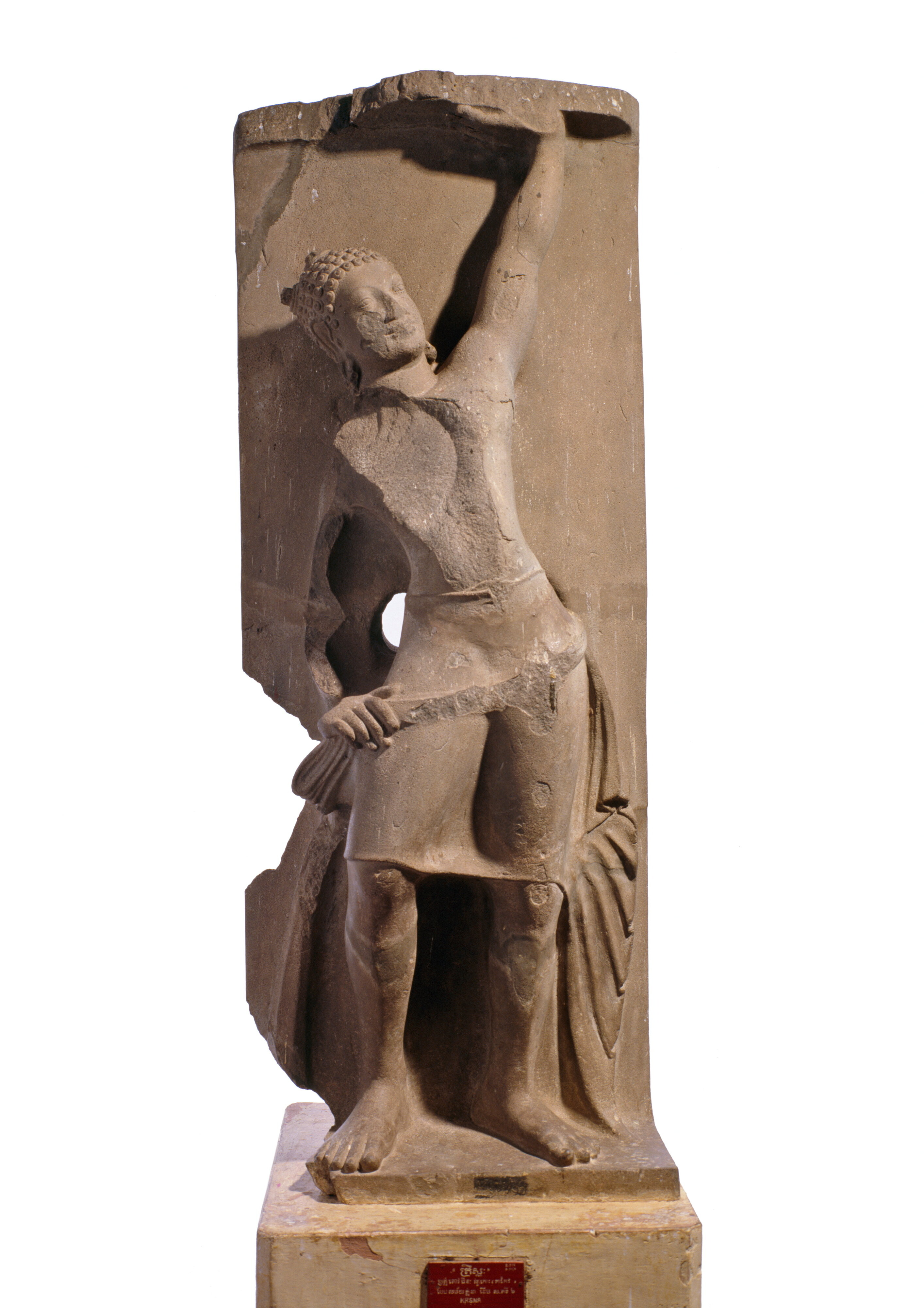 <p>Cambodia, Takeo, Angkor Borei, Wat Koh, Pre-Angkor period (c100–800), Phnom Da style <em>Krishna Govardhana</em> late 500s, sandstone, 161 × 65.5 × 35.2 cm excl tenon, National Museum of Cambodia, Phnom Penh</p>
