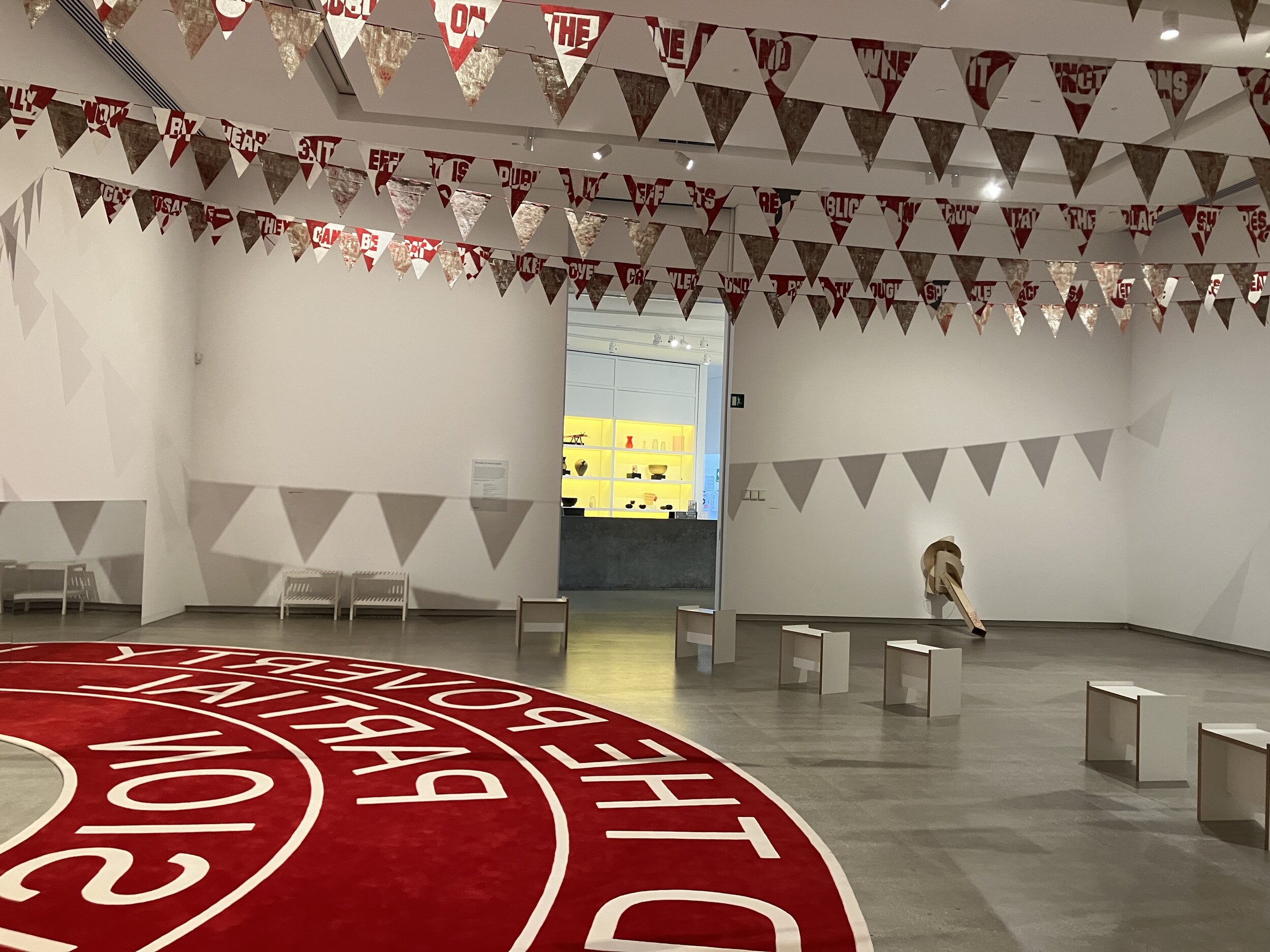 <p>Installation view, Rose Nolan, <em>Big Words (Not Mine) — Transcend the poverty of partial vision (floor version)</em>, 2021, <em>Big Words (Not Mine) – Read the words “public space”…</em>,<em> </em>2013, and <em>Low-Down</em> <em>White Trash Work, </em>1995, TarraWarra Museum of Art. Photo: Ella Howells.</p>