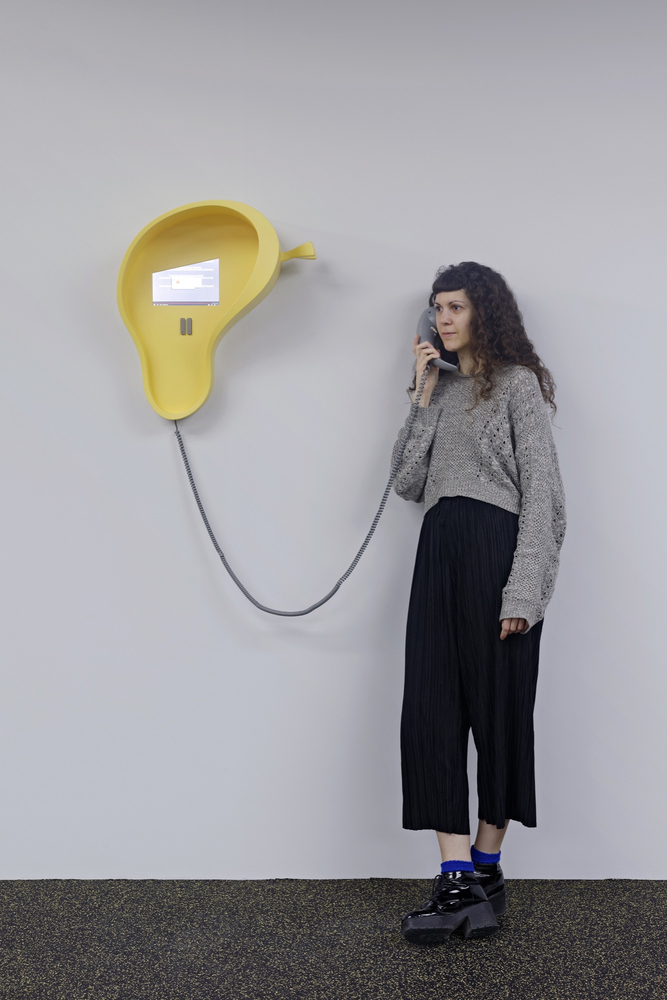 Camille Henrot, <em>Bad Dad & Beyond</em>, 2015, three dimensional resin print, HDMI 4 pi 10.1”, HMDI cable, 9V AC/DC 1000 mA, power adaptor, IR sensor, 8 ohm speaker small, class D amp, soundcard (USBconnected), 1/8” cable, pushbutton, jumper wire: 6-pin female conn, RJ11 jack, 25 ft Vodavi Gray Phone Cord, Rasp Pi 2 Model B V1.1, power cord USB, ethernet cable, 24 x 20 x 9 inches (phone) 61 x 50.8 x 22.9 cm, 44 x 20 x 9 inches (overall) 111.8 x 50.8 x 22.9 cm. Edition 1 of 2, 1 AP. Image courtesy of the National Gallery of Victoria.