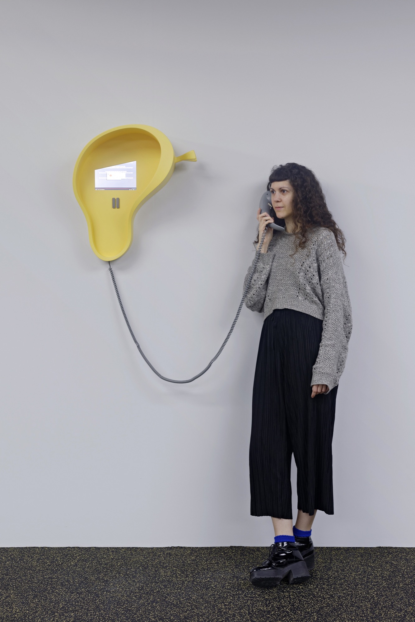 Camille Henrot, <em>Bad Dad &amp; Beyond</em>, 2015, three dimensional resin print, HDMI 4 pi 10.1”, HMDI cable, 9V AC/DC 1000 mA, power adaptor, IR sensor, 8 ohm speaker small, class D amp, soundcard (USBconnected), 1/8” cable, pushbutton, jumper wire: 6-pin female conn, RJ11 jack, 25 ft Vodavi Gray Phone Cord, Rasp Pi 2 Model B V1.1, power cord USB, ethernet cable, 24 x 20 x 9 inches (phone) 61 x 50.8 x 22.9 cm, 44 x 20 x 9 inches (overall) 111.8 x 50.8 x 22.9 cm. Edition 1 of 2, 1 AP. Image courtesy of the National Gallery of Victoria.