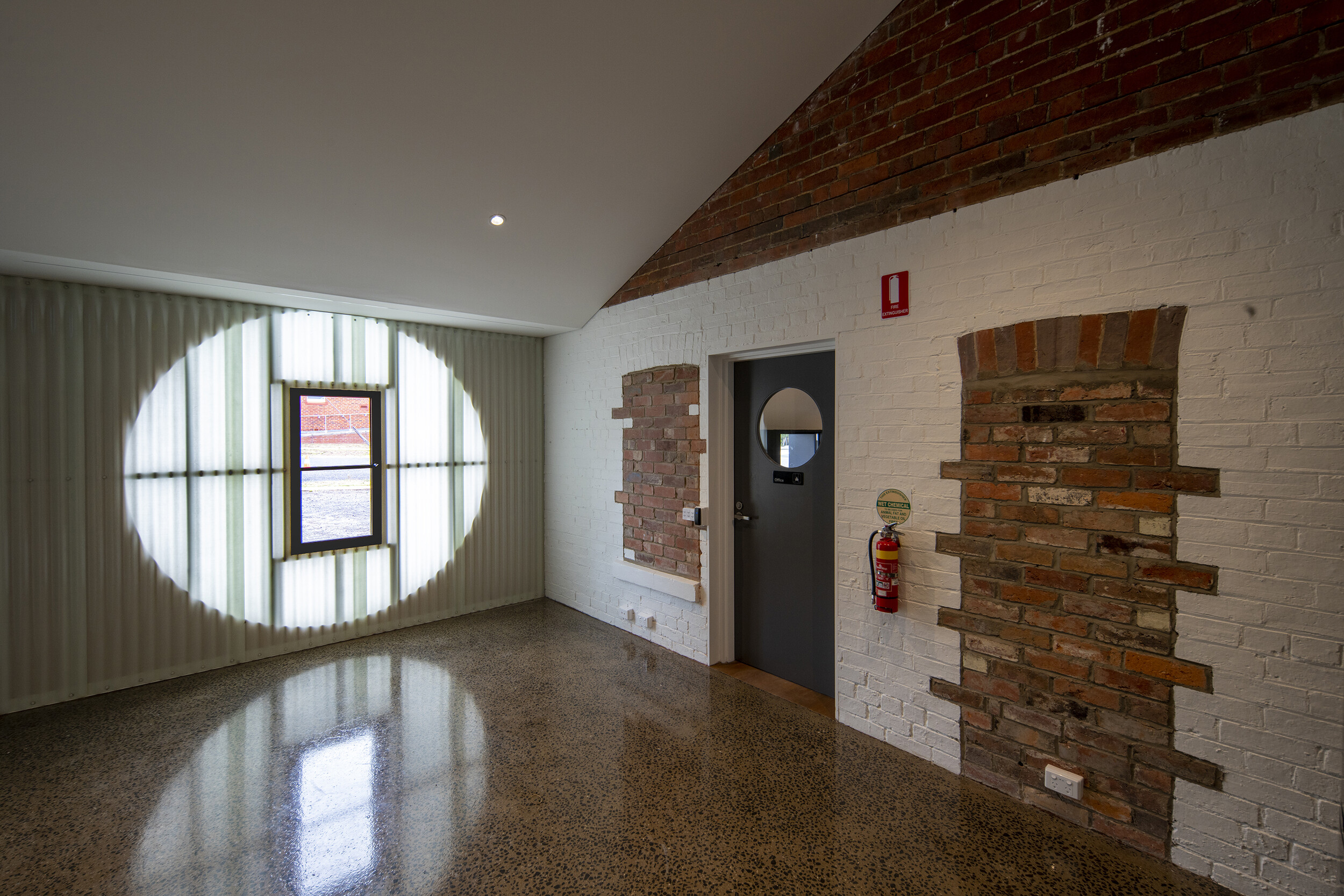 <p>The “sun/moon” wall seen from the gallery’s workshop space. Photograph by John Gollings.</p>