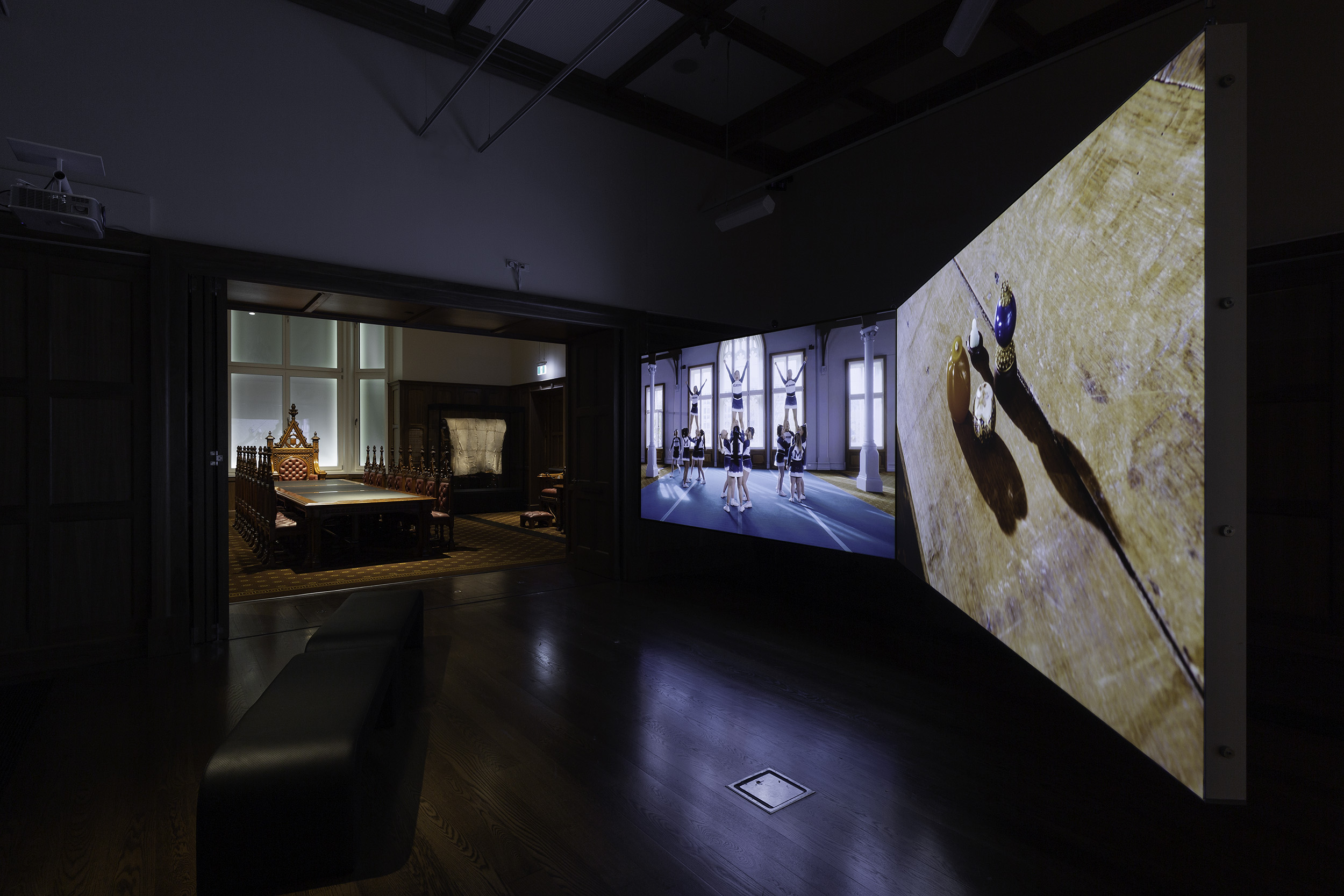Installation view of Andy Butler, The Agony and the Ecstasy 2022, 2-channel video, 8 min. On display in Collective Unease at the Ian Potter Museum of Art, Old Quadrangle, University of Melbourne. Photo: Christian Capurro. Courtesy of the curators.
