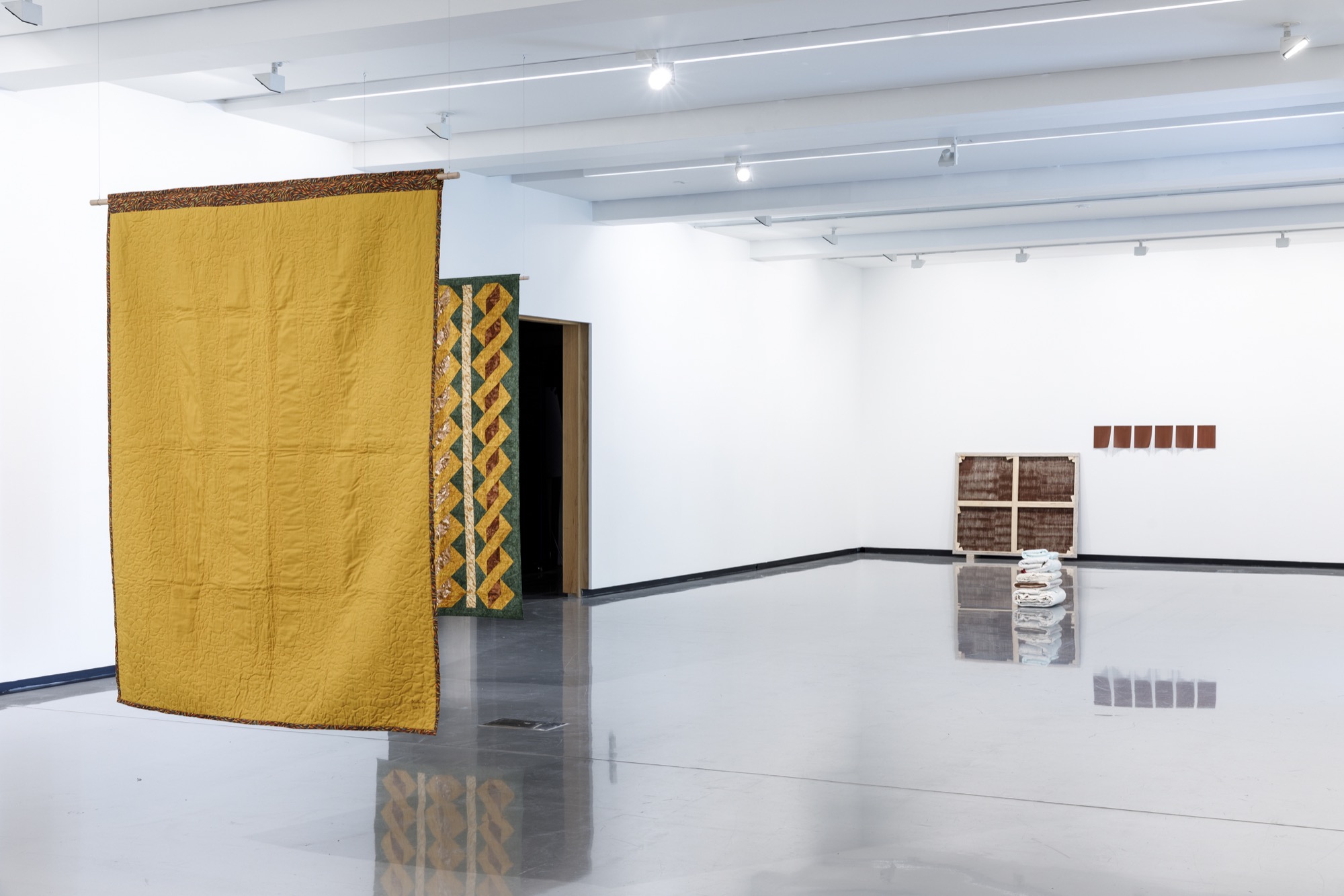Kate Harding, <em>Carnarvon underground water 2020</em> and <em>Cylinders 2020 (detail)</em> and Dale Harding, <em>Extractive painting 2</em> 2021. Installation view, <em>Dale Harding: Through a lens of visitation</em>, Monash University Museum of Art, Melbourne, 2021. Photo: Andrew Curtis. Image courtesy of the artist and Milani Gallery, Brisbane.