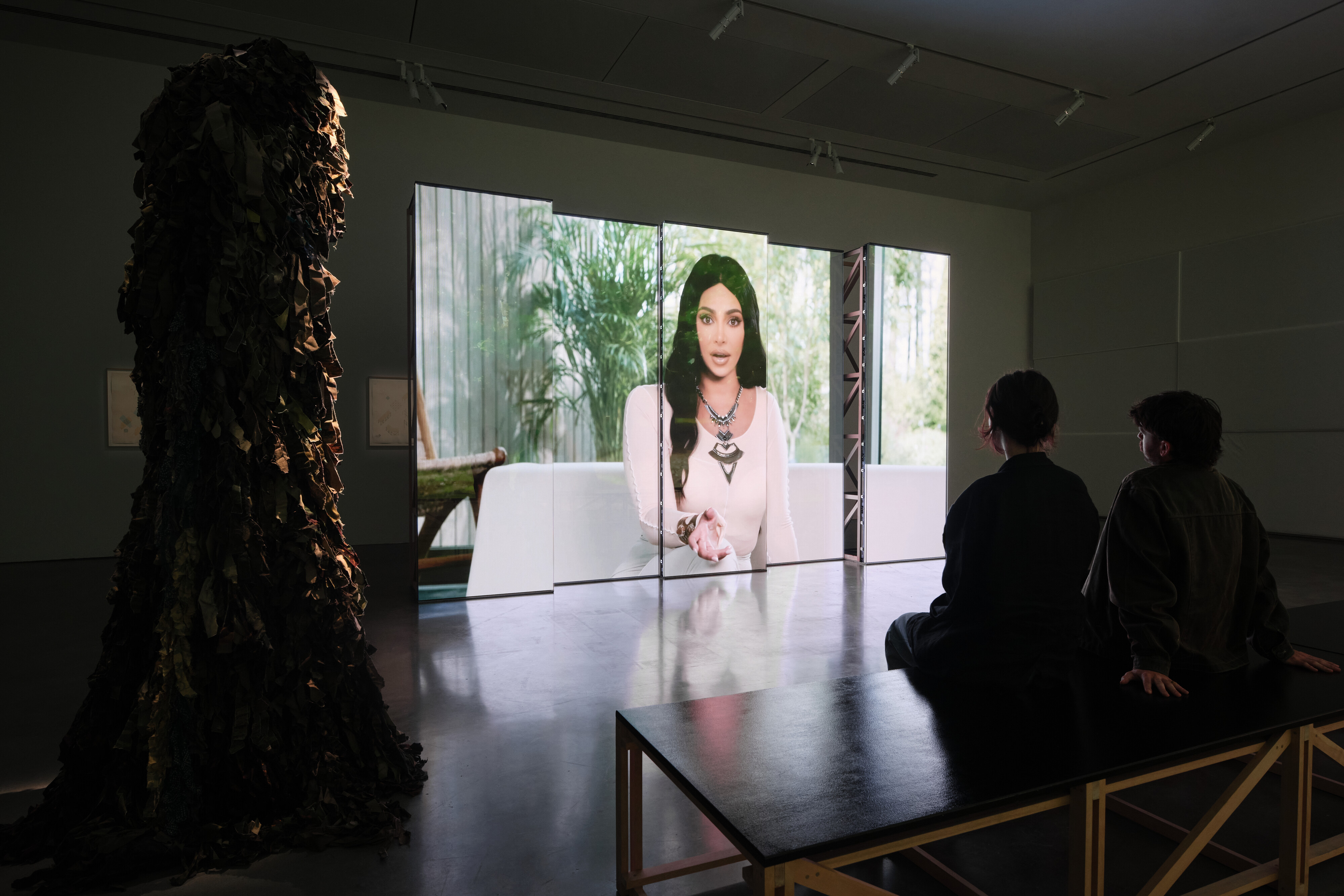 <p>Christopher Kulendran Thomas, <em>The Finesse</em>, 2022, in collaboration with Annika Kuhlmann, installation view, <em>Data</em> <em>Dreams: Art and AI</em>, Museum of Contemporary Art Australia, Sydney, 2025, multi-channel video (37:03 minutes, looped) on LED screens with HD projection, featuring sculptures by Aṇaṅkuperuntinaivarkal Inkaaleneraam and architectural drawings from the Earth Net Archives, image courtesy the artist and Museum of Contemporary Art Australia © the artist, photograph: Hamish McIntosh</p>