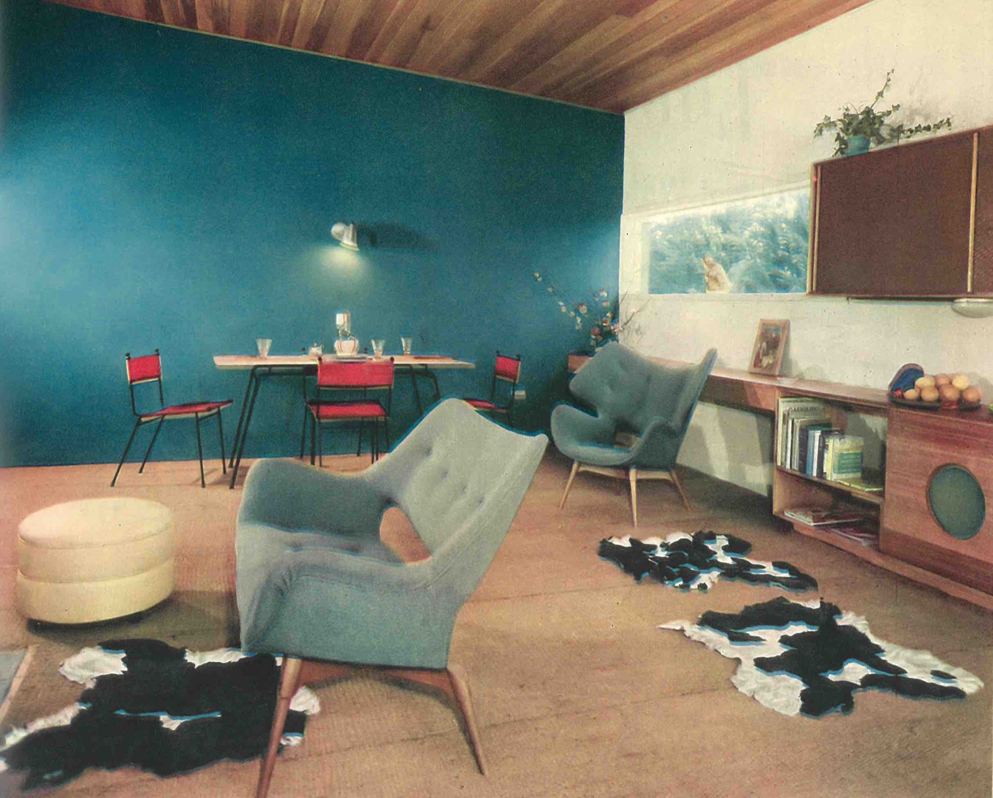 BS211H Television Space Settee, B220H Curl-up Contour Chair and BS211 with Clement Meadmore Dining setting featured in living room, Darbyshire, House, Templestowe, architect Robin Boyd. Australian Home Beautiful, October 1954.
