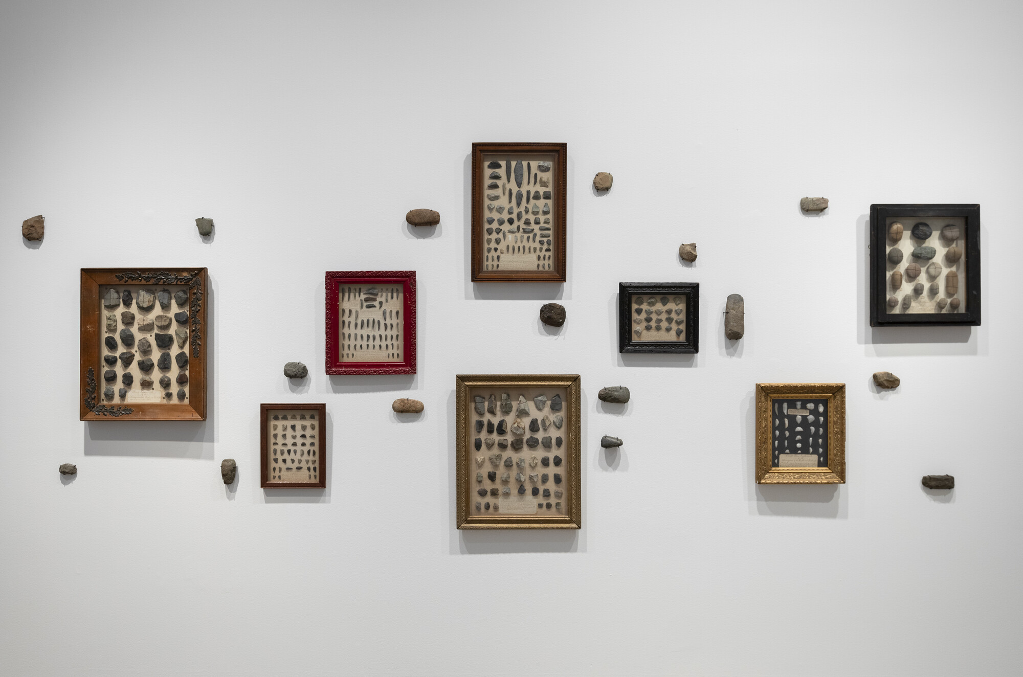 <p>Exhibition view, <em>Dhuluny: the war that never ended</em>, Bathurst Regional Art Gallery, 6 July – 8 September 2024, featuring Unknown Ancestors, <em>Stone tools</em>, pre-invasion, stone. Collection of the Bathurst District Historical Society. Photo: Silversalt Photography.</p>