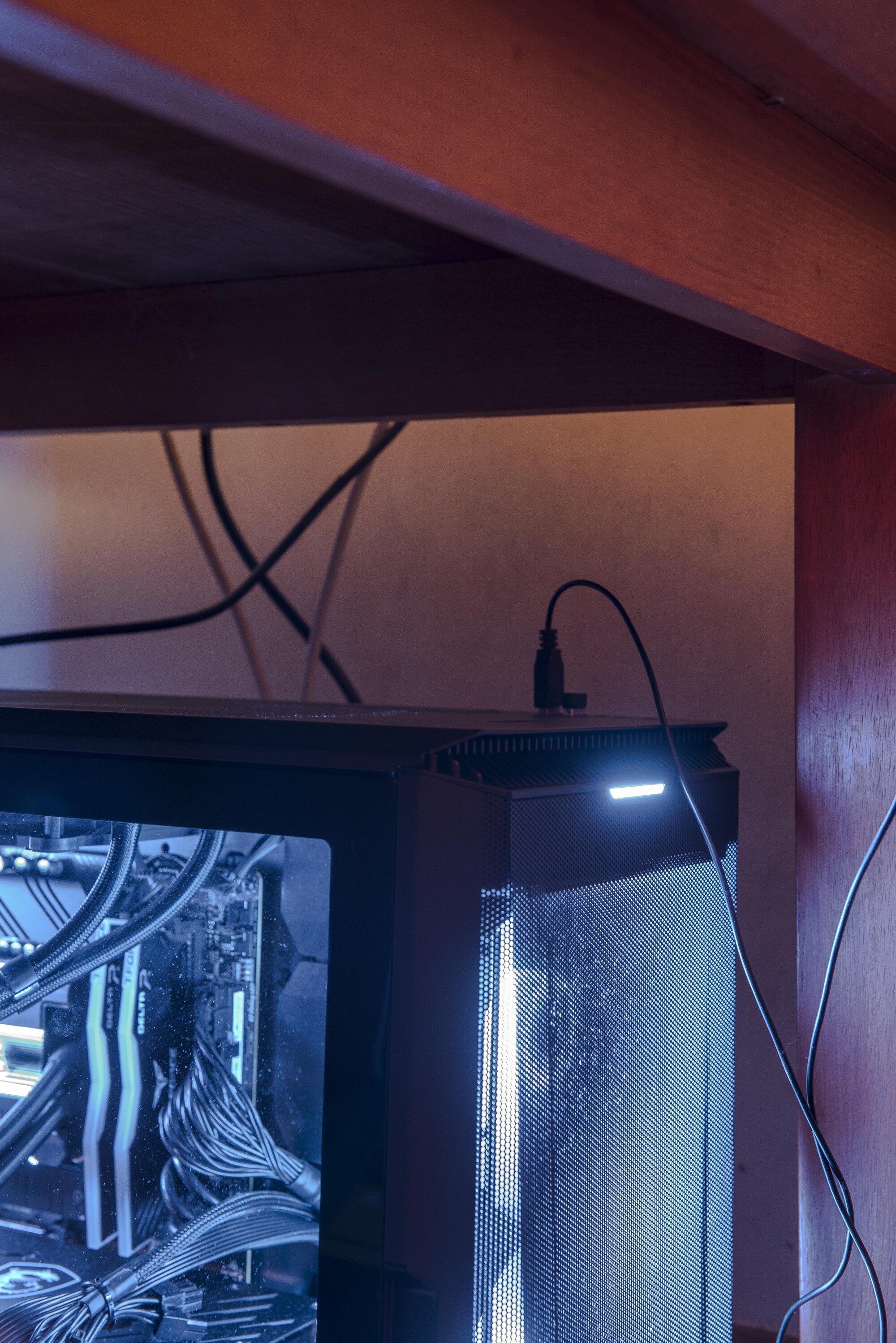 Installation view of David Attwood, <em>Dust Blaster</em>, 2022, Mini Desktop Blower Vacuum, 30m USB extension cable, gallerist’s home computer, 16 x 8 x 5.5 cm. Photo: Christo Crocker