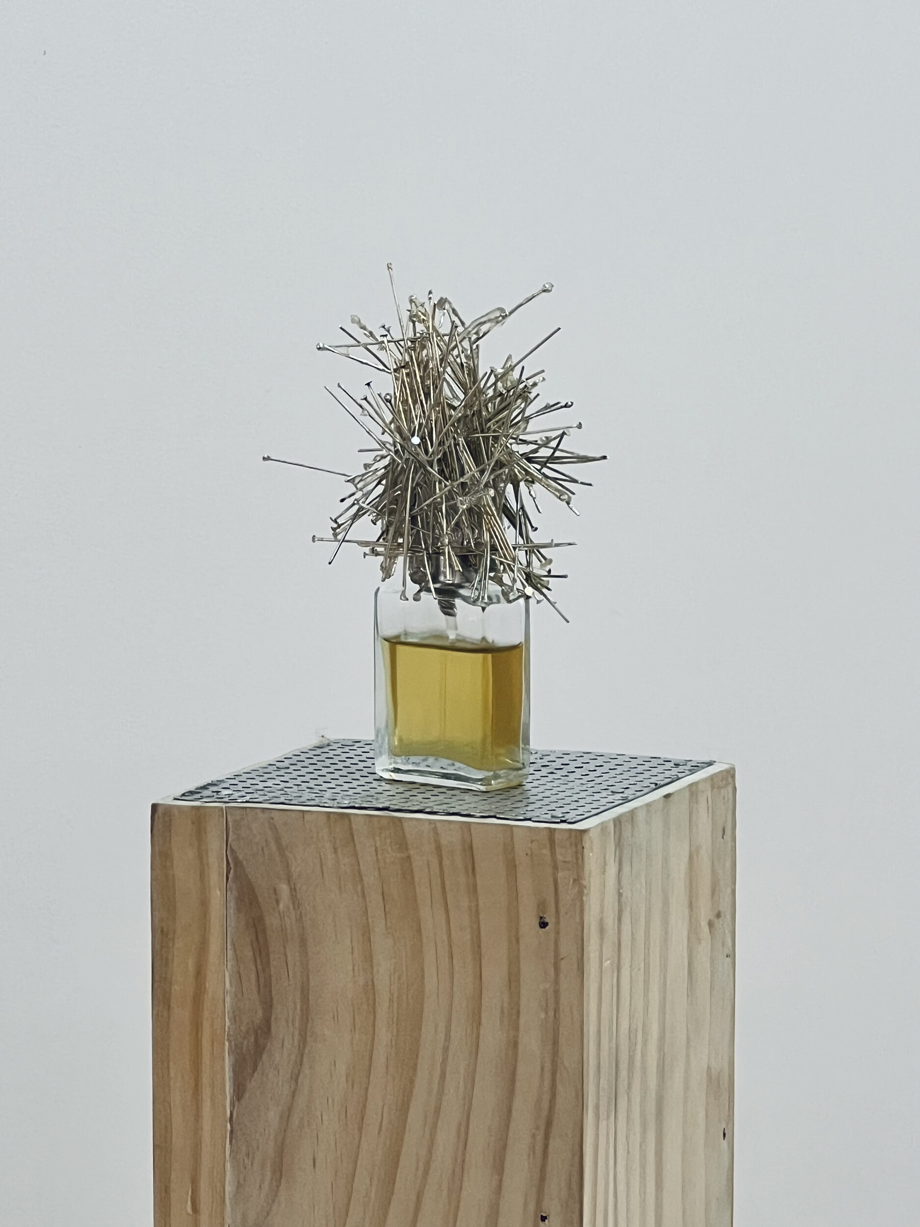 <p>Detail of Jesse Wakenshaw, <em>Pillar of collapse</em>, 2025, dimensions variable, epoxy resin, glass bottle, stainless steel jewellery posts, scent: <em>Chaos </em>extrait de parfum 15 ml, Airspace Projects. Photo: Jesse Wakenshaw.</p>