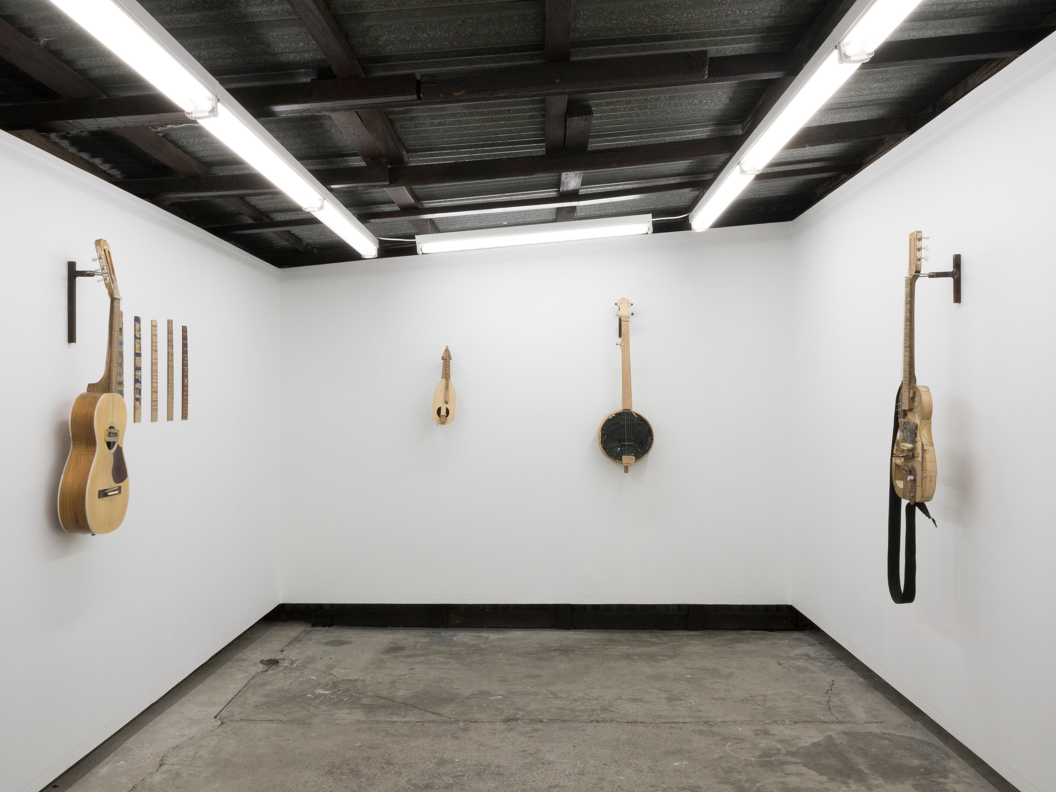 <p>Installation view of Darcy Wedd, Jive Deceleration, 2024, various materials, including: magnets, seatbelts, copper, olive wood, Tasmanian oak, silver, nails, coloured pencils etc, Asbestos. Photo: Aden Miller.</p>