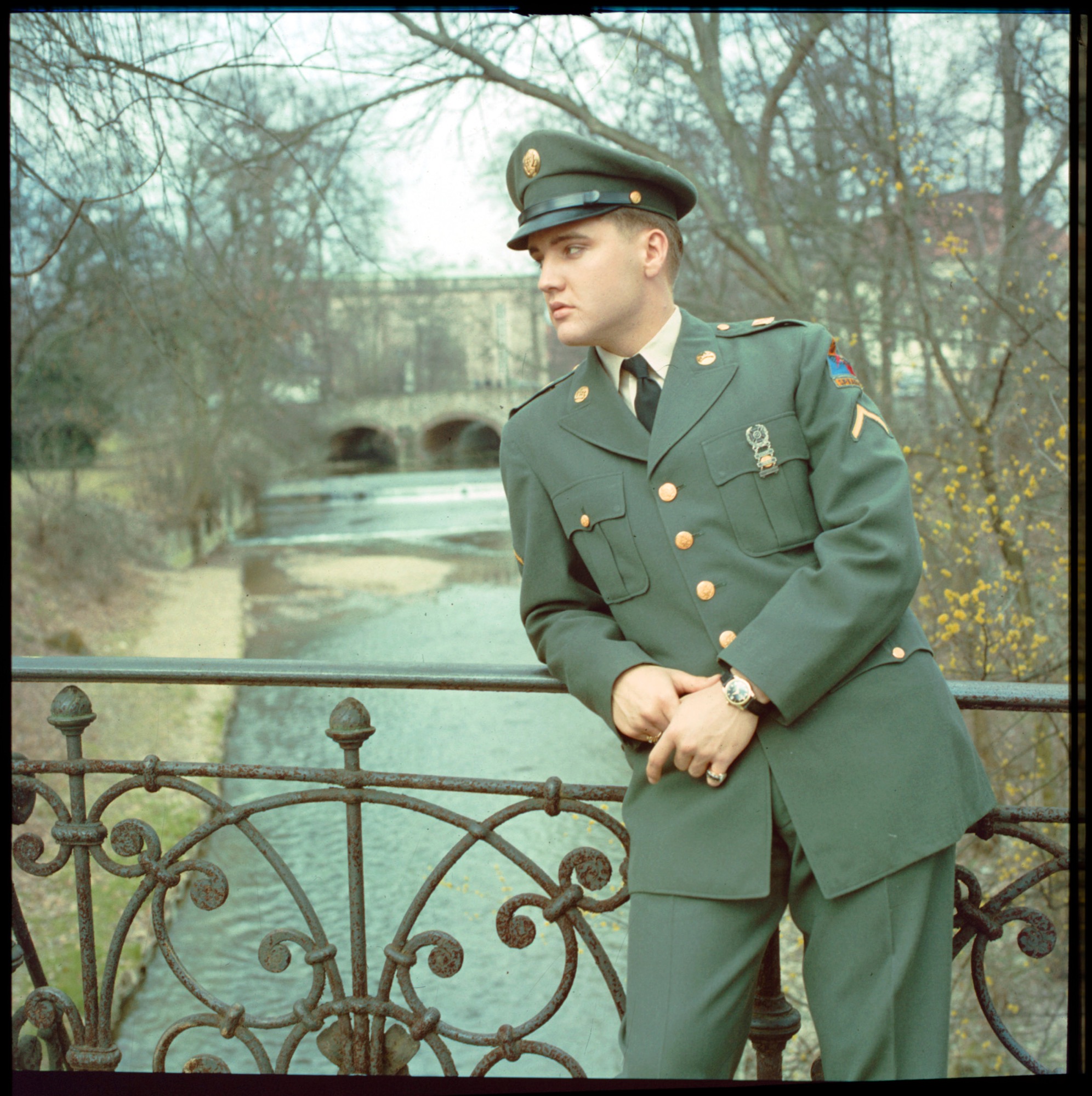 Elvis on the bridge in Bad Nauheim Germany, 1959. © EPE. Graceland and its marks are trademarks of EPE. All Rights Reserved. Elvis Presley™ © 2022 ABG EPE IP LLC.