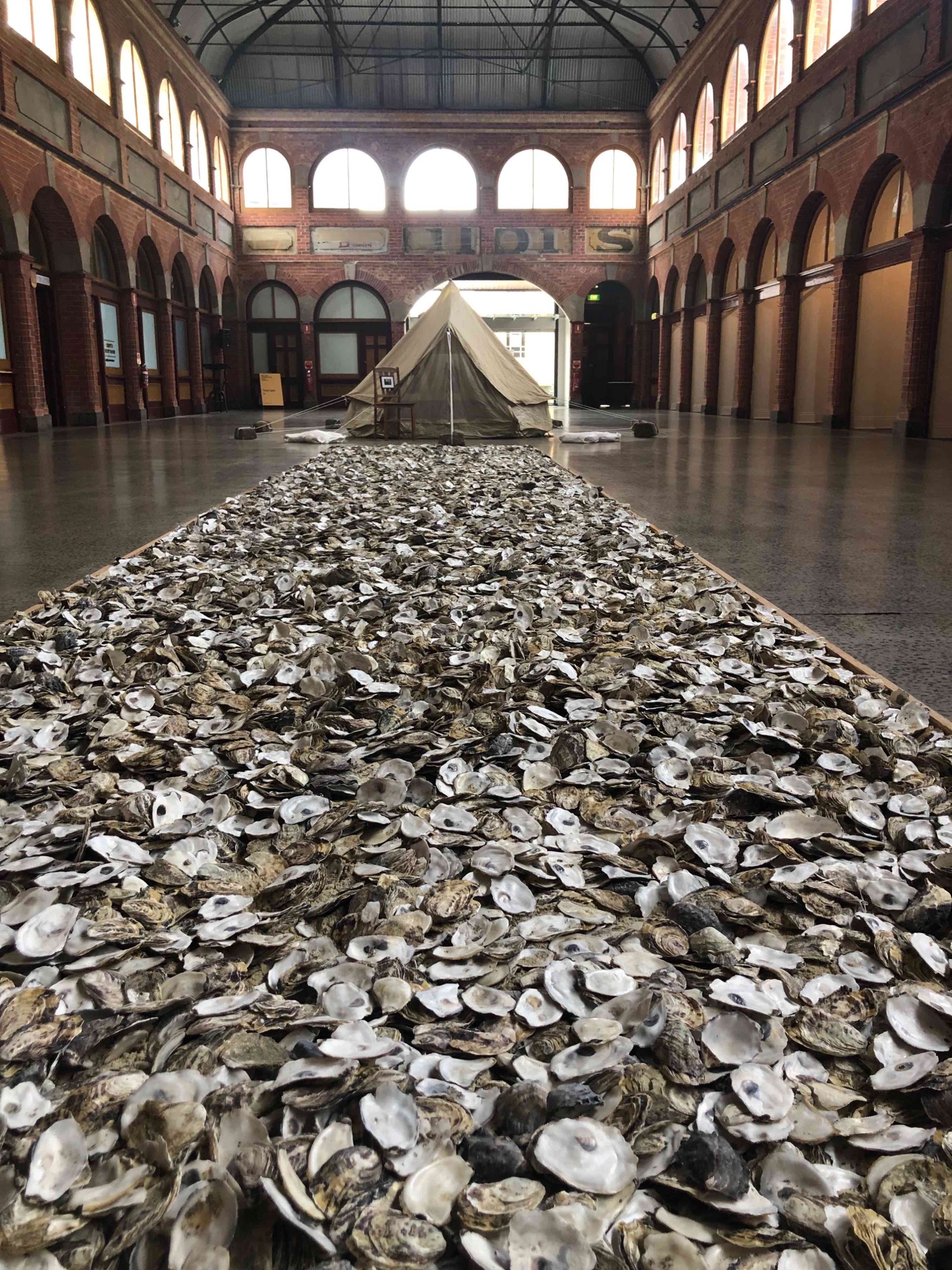 Fiona Foley, <em>Who are these strangers and where are they going</em>? Oyster shells and sand. August 2019, Ballarat Mining Exchange.