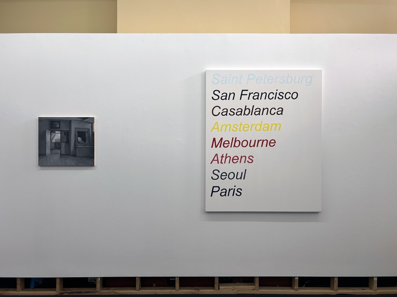 <p>Installation view of Madeleine Peters, <em>Adjusted View From A Mother’s Duty (After De Hooch), </em>2025, oil on board, 48 x 55 cm (left) and Olivia Wood, <em>Global Cities (dandy painting), </em>2025, oil on canvas, 140 x 115 cm (right). Photo: Conners Conners</p>