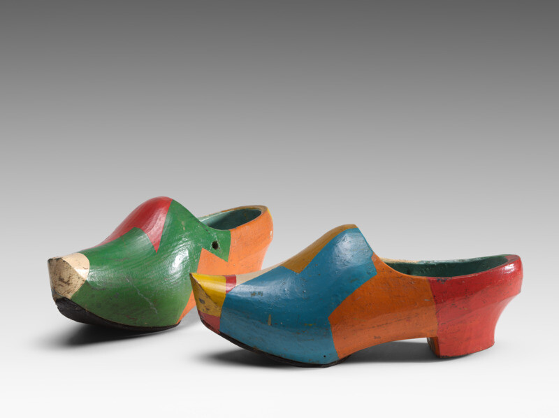 <p>Ralph Balson, <em>Pair of clogs,</em> c1940-1945. Painted wood, 10.4 h x 26 w x 9.6 d cm, National Gallery of Australia, Canberra.</p>