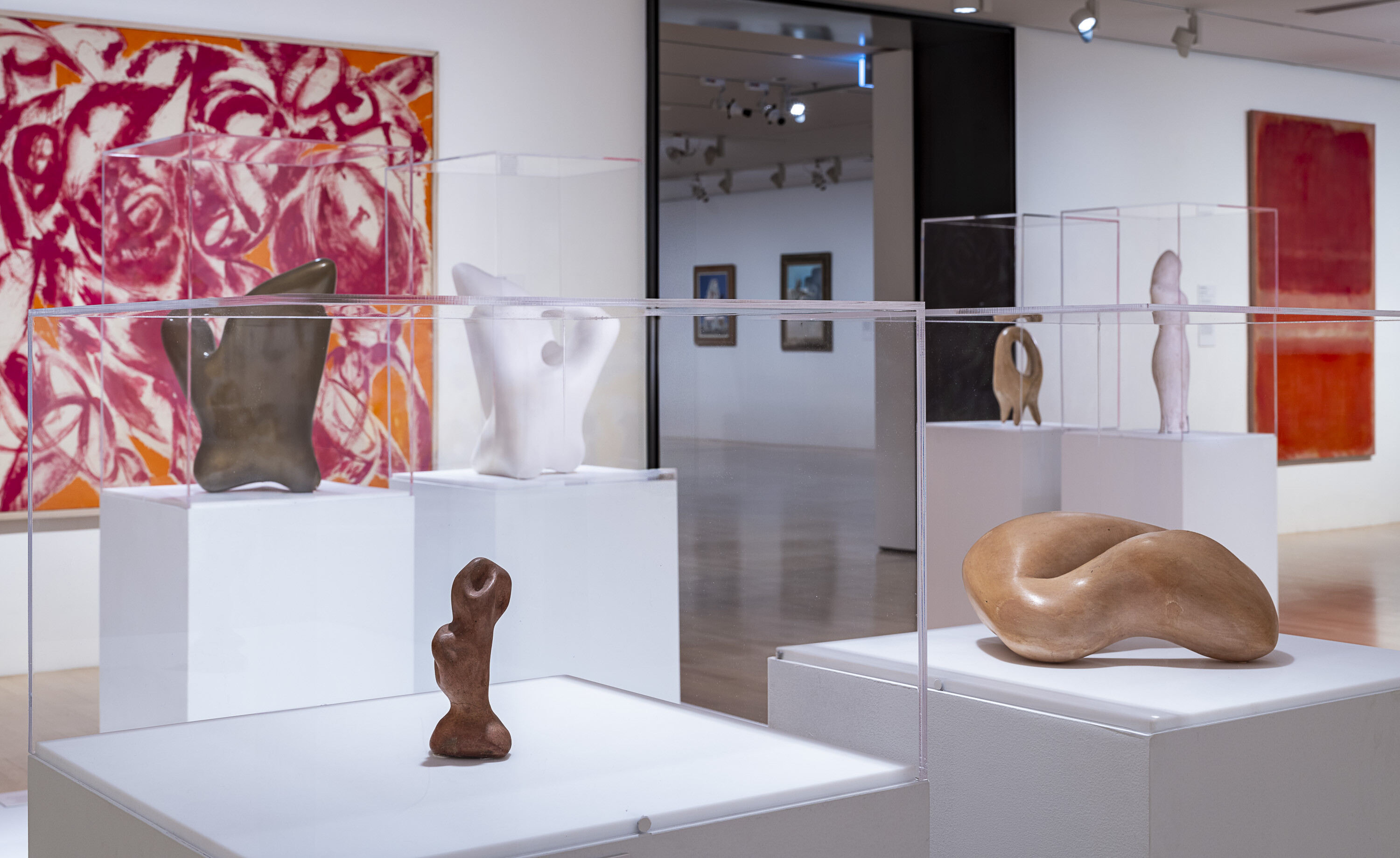 <p>Installation view of Lee Krasner, <em>Combat</em>, 1965, oil on canvas, and Hans Arp, <em>Flower Muzzle</em>, 1960, plaster version cast 1980s, bronze version cast 2021 (ed. 5/5), on display at NGV International. Works by Hans Arp generously gifted by the artist’s estate Stiftung Arp e.V. Photo: Garry Sommerfeld.</p>