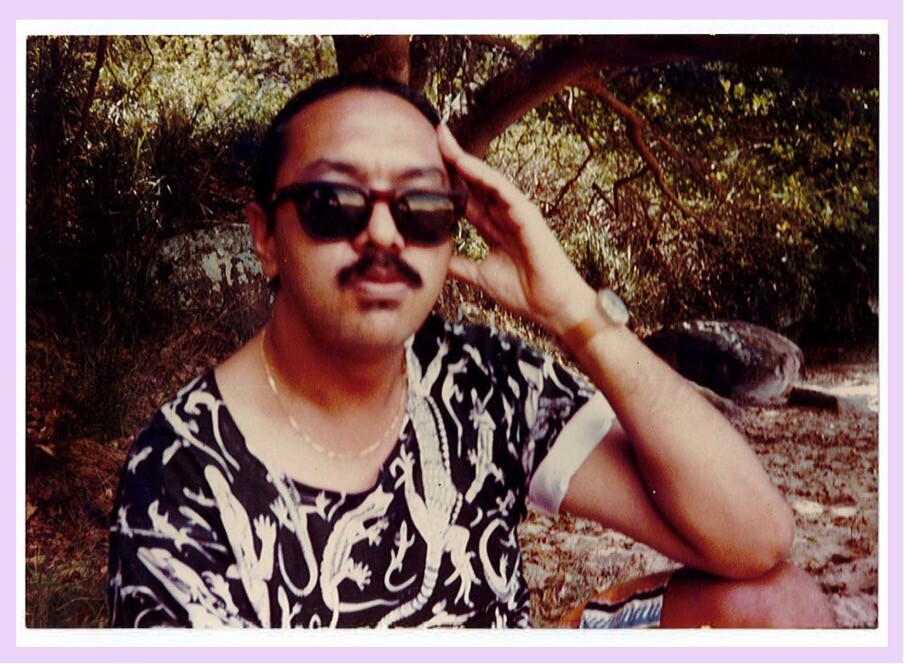 <p>Gary Lee in Sydney, c. mid-’80s wearing a T-shirt from Tiwi Design with ‘Lizard design print’ by Angelo Munkara and Ray Young; photographer unknown. Reproduced in the article “Aboriginal art ripoff,” <em>heat: selected texts & anthropology</em> (2023), 40-1. Article first published as the foreword by Gary Lee, Aboriginal Students’ Association, Australian National University (ANU), to an article Rag Trade Art Heist, on the theft of Aboriginal art, reprinted from Land Rights News, December 1987 in <em>Worona</em>, ANU newspaper, 24 March 1988, page 24.</p>