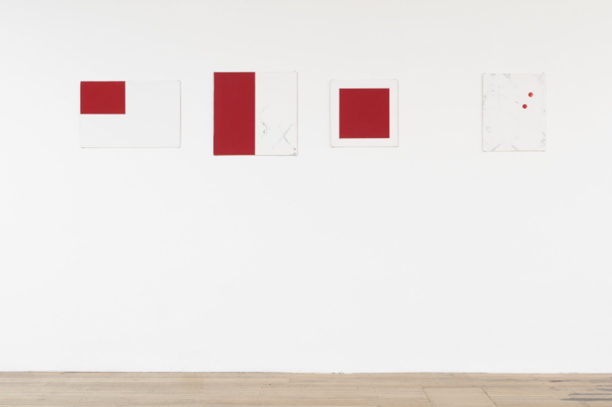 Scott Redford (installation view, left to right), <em>Untitled (Blank flag/The red acrylic mixed with AZT)</em> 1998, enamel, acrylic and AZT on board; <em>Untitled (the red acrylic paint mixed with AZT)</em> 1998, enamel, acrylic and AZT on board; <em>Untitled (Red square/ the red acrylic mixed with AZT)</em> 1998, enamel, acrylic and AZT on board; <em>Above the elbow on the guy’s arm at the Wickham 3rd version</em>, 1997, enamel and acrylic on board. Photograph: Matthew Stanton.