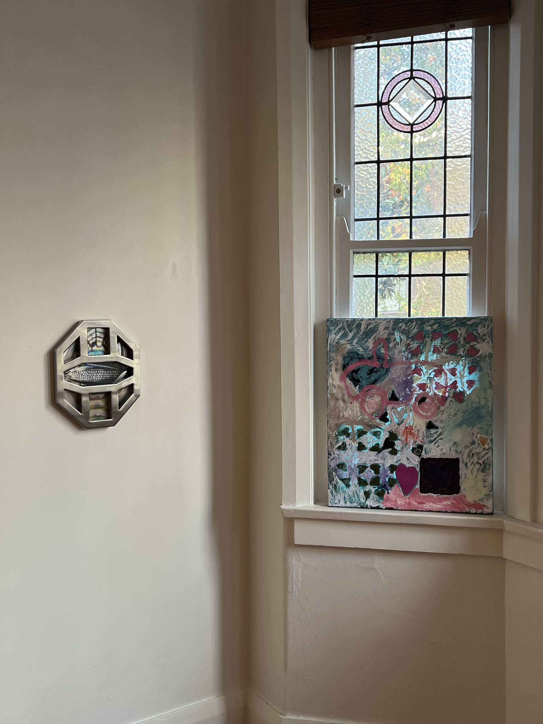 Left: Jennifer Mathews, <em>Maize</em>, 2022, stainless steel, transparency print, aluminium, 34 cm x 27 cm. Right: jemi gale, <em>the only way out is through / and all i want is you (heart practice)</em>, 2022, acrylic paint, oil paint, nail polish, spray paint, collage, heart charm on stretched silk, 61 cm x 51 cm. Image courtesy of Suite7a