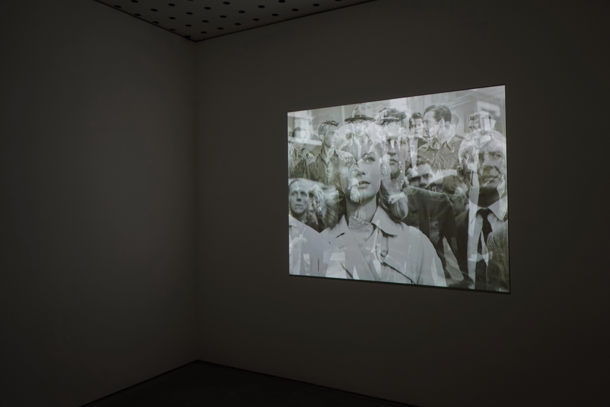 John Stezaker, <em>Crowd</em>, 2013, digital video, 40-minute loop, installation view, photo: Helen Sakkas. Courtesy of The Approach, London.
