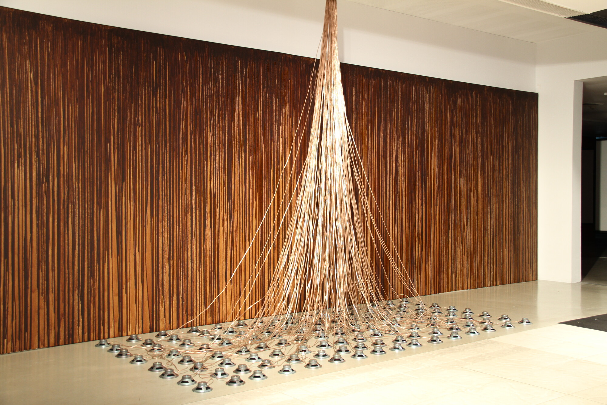 Khaled Sabsabi, Aajnya, 1998/2021. 2 channel audio, coffee, canvas, audio speakers, wire, and paint. Campbelltown Arts Centre, 2022. Credit: Document Photography