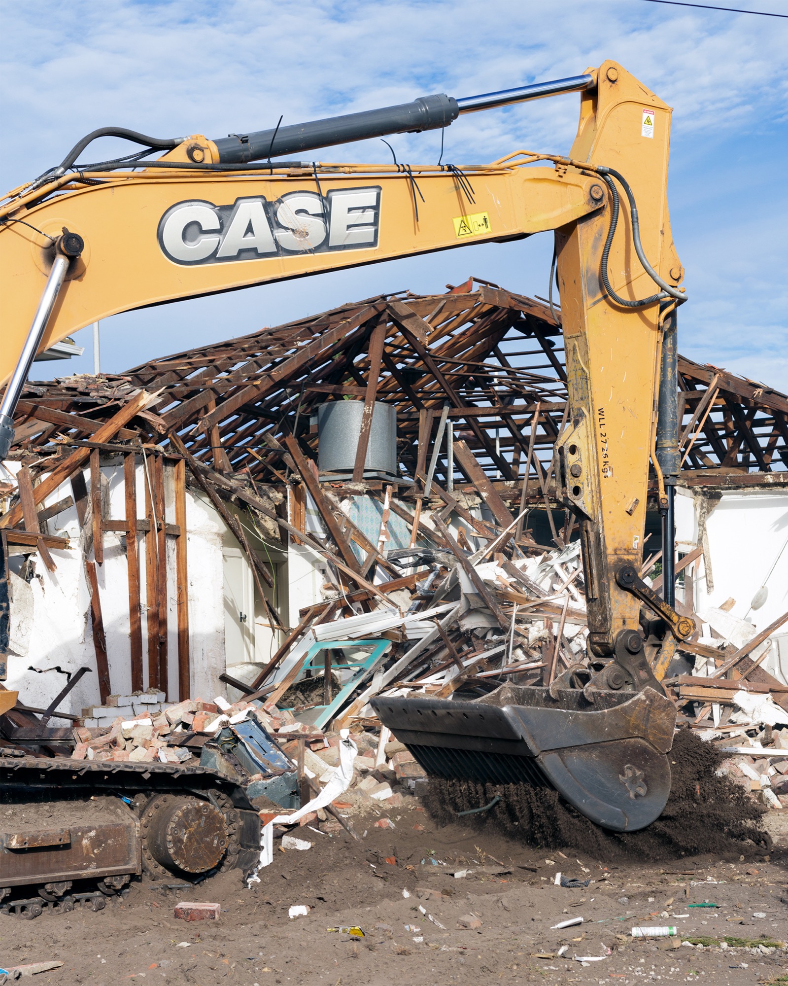 Kieren Seymour, <em>Excavator and House,</em> 2018, Photograph printed on archival rag, 71 x 61 cm. Image courtesy the artist and Block Projects.