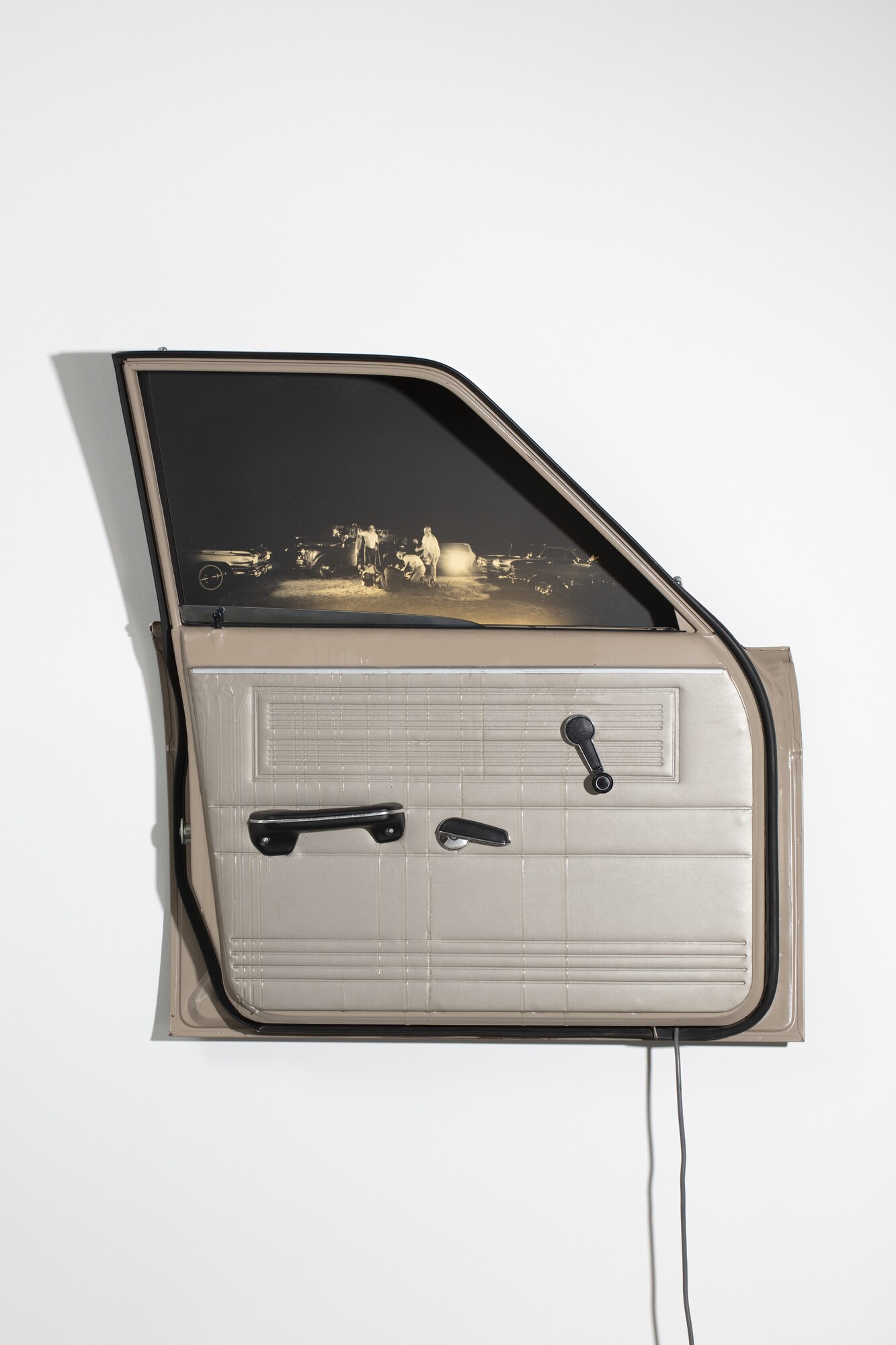 Edward Kienholz, <em>Sawdy</em>, 1971, car door, mirrored window, automotive lacquer, polyester resin, screenprint, flourescent light, galvanised sheet metal, Power Collection PW1972.29.2, © Estate of Nancy Reddin Kienholz. Courtesy of LA Louver, Venice, CA.
