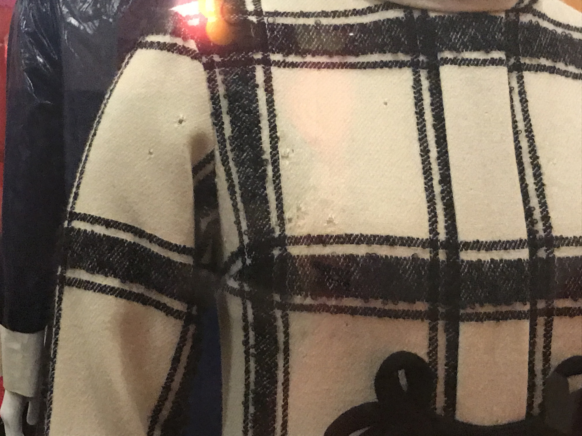 Mary Quant, <em>Coat-Dress (detail)</em>, 1962.<br />
Wool tweed with silk frogging<br />
Given by the family of the late Philip Pollock<br />
V&A: T.286-2020<br />
Photo: Michelle Guo