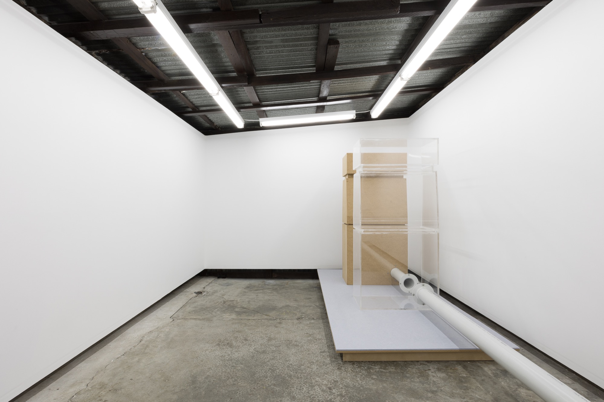 Installation view of Hugo Blomey, <em>Humility Circuit</em>, 2023, MDF, acrylic, fibreglass acoustic panel, PVC pipe, flanges, stainless steel fasteners, air pump, dimensions variable. Courtesy of Asbestos.