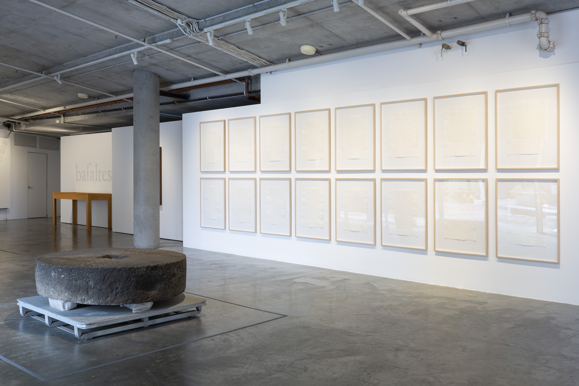 Mitchel Cumming and Kenzee Patterson, <em>Redistribution (forbearing / forthcoming)</em>, 2021, 16 blind debossed prints in repurposed frames, 67 × 90cm (each). Photograph: Jessica Maurer