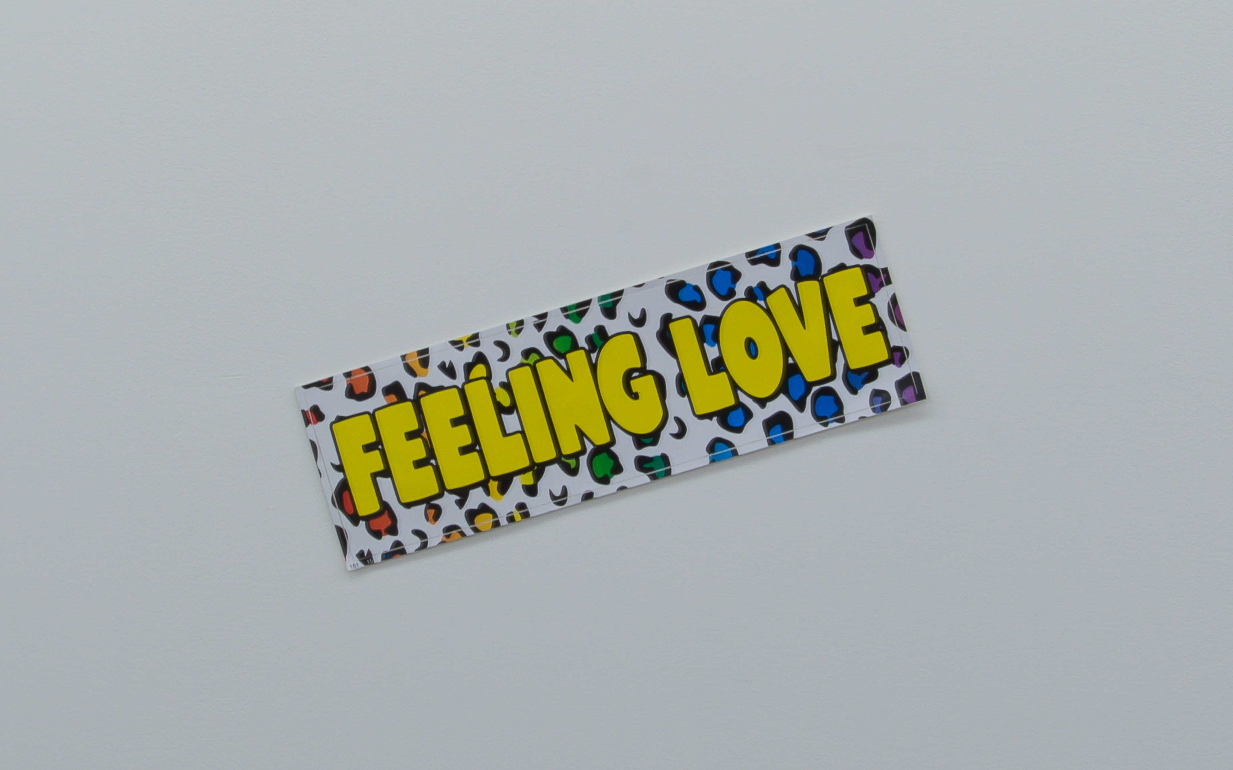 Jordan Wolfson, <em>Feeling Love</em>, 2019, Vinyl decal, 26 x 8cm. Photo courtesy of Asbestos.