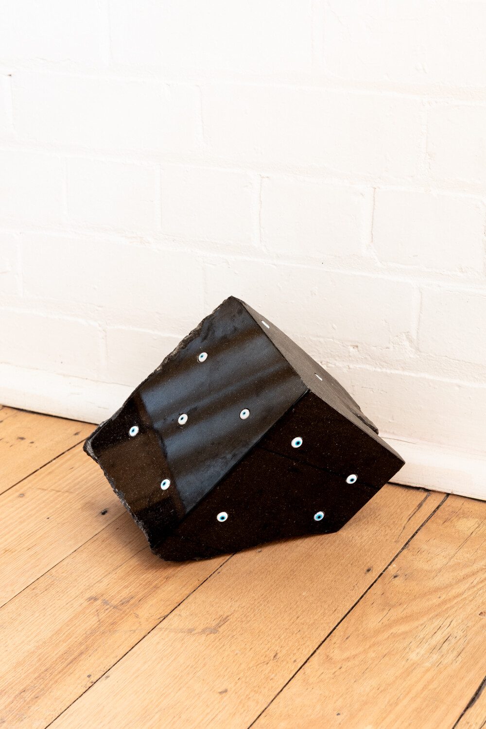 <p>Tina Stefanou, ‘Motet Fail’, 2026, concrete, carpet, wood, stone, granite, sand, beeswax, fire, installation view, West Space. Photography by Janelle Low.</p>