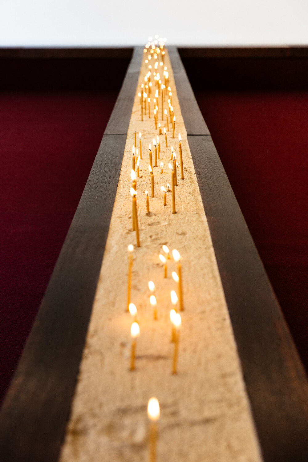 <p>Tina Stefanou, ‘Motet Fail’, 2026, concrete, carpet, wood, stone, granite, sand, beeswax, fire, installation view, West Space. Photography by Janelle Low.</p>