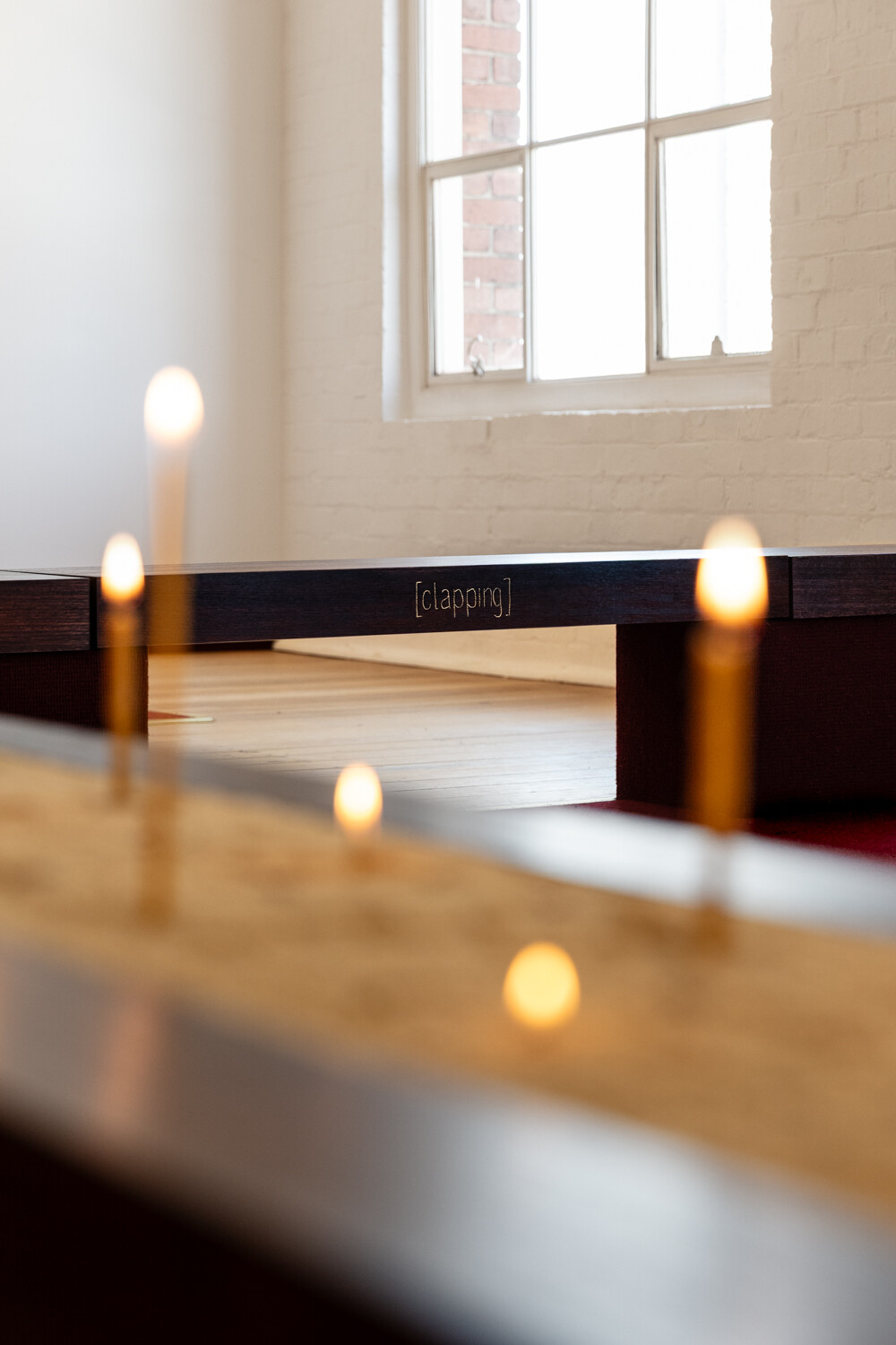 <p>Tina Stefanou, ‘Motet Fail’, 2026, concrete, carpet, wood, stone, granite, sand, beeswax, fire, installation view, West Space. Photography by Janelle Low.</p>