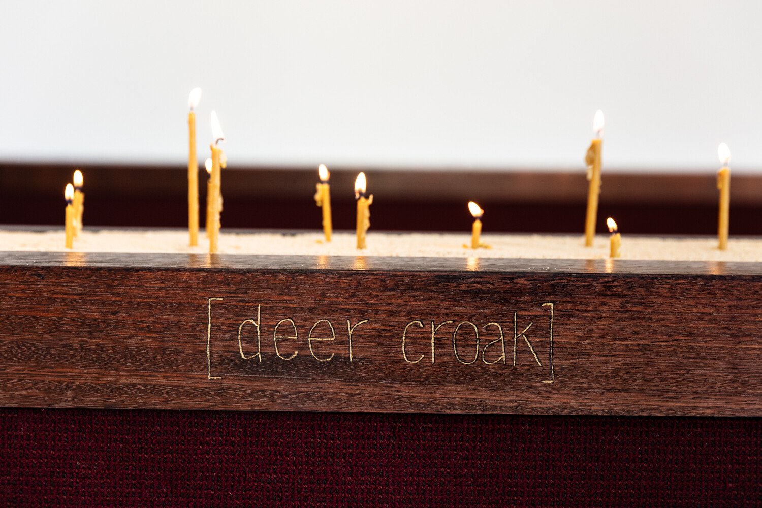 <p>Tina Stefanou, ‘Motet Fail’, 2026, concrete, carpet, wood, stone, granite, sand, beeswax, fire, installation view, West Space. Photography by Janelle Low.</p>