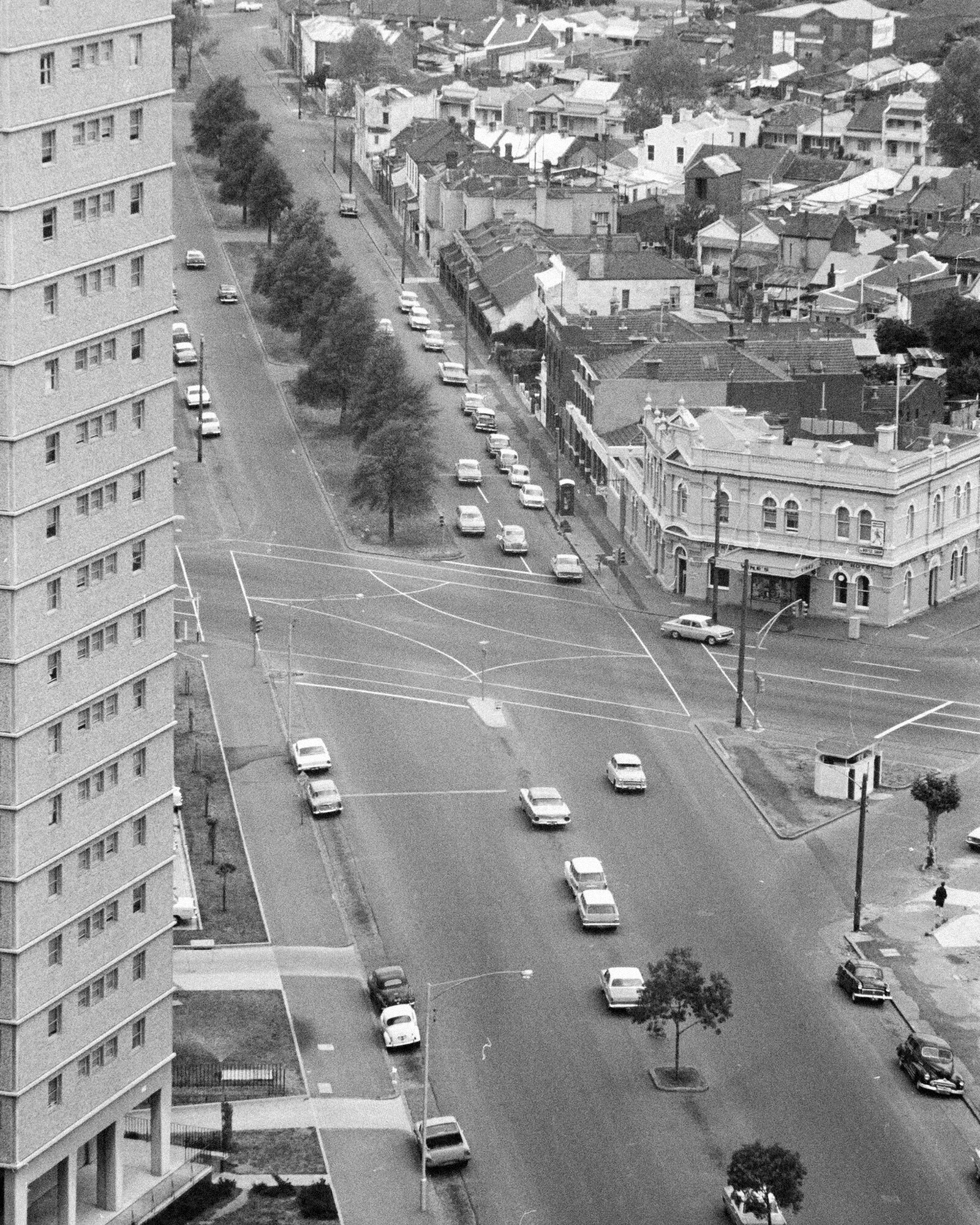 <p>A view from inside one of the freshly built towers shows how Neil Street looked in the 1960s. Today this area is pedestrianised. Photograph by Alan K. Jordan, courtesy of the State Library of Victoria.</p>