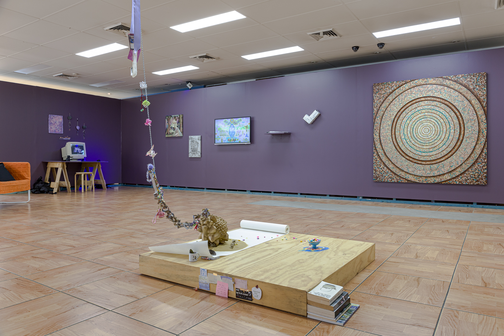 Installation view of Emma Harbridge, <em>Surrender ur Weapon &amp; Rest ur Heart</em>, 2022-2023, 3D prints, spray paint, decorative sand, ceramics, hair accessories, ribbon, stickers, origami stars, soap holder, diamond leaf, scroll, Pari. Photo: Document Photography